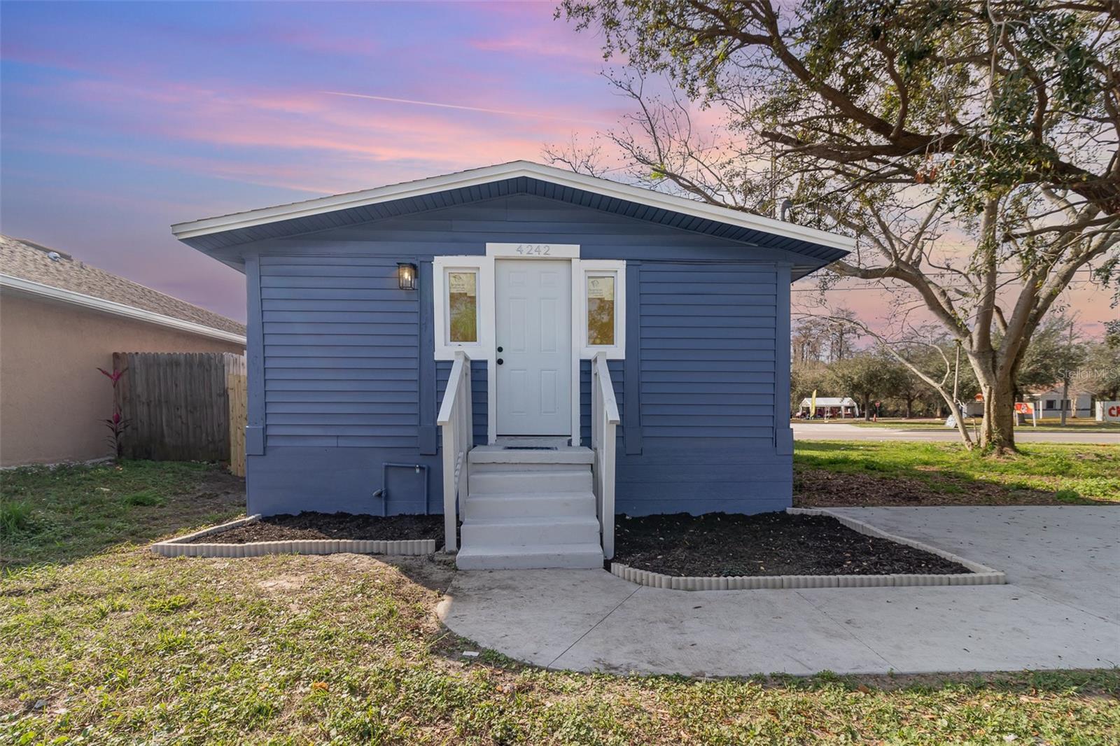One or more photo(s) has been virtually staged. Priced at $239,999 with 100 financing available for qualified buyers.
Completely renovated 3-bedroom, 2-bath Orlando home with modern finishes, abundant natural light, and a functional open layout.
No HOA and conveniently located near shopping, medical facilities, public transit, and major roadways.

Inside, the home features laminate flooring throughout the main living areas, fresh neutral finishes, ceiling fans, and a bright living/dining combo that flows into the updated kitchen with light cabinetry, granite countertops, subway tile backsplash, and stainless steel appliances. Both bathrooms have been renovated with updated tile and vanities. Confirmed major improvements include roof (11/2024), AC (12/2024), water heater (1/2025), and double-pane windows. Exterior features include mature oak trees, sidewalk frontage, vinyl siding, and a manageable 0.10-acre lot. Vacant and easy to show.