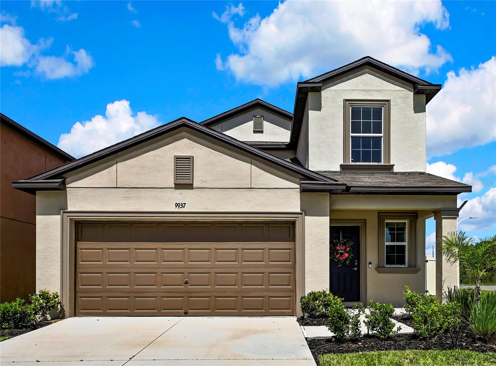 One or more photo(s) has been virtually staged. Turn-key and meticulously maintained beautiful home, nestled in the sought out Manor of Epperson Lagoon community, in Wesley Chapel, Florida.  
Upon entry you'll be welcomed to roaring 20 foot ceilings and luxury vinyl flooring through out the first floor and steps leading to the 2nd floor loft and hallway. 
It features:  Recess Lighting with dimmers in the Kitchen/Dining area + Decorative Crystal Lamp with multi-light color change in the dining area + Ceiling Fans in the living room and every bedroom + large primary bedroom located on the first floor + 4 spacious rooms with closets on the 2nd floor that can be used as bedrooms, home office, gym or nursery + Huge Loft that can be used for an office, gaming room or family lounge + new Dishwasher & Dryer (2024), Levolor Cordless Blinds in every window + Ring Door Bell included + Private Fenced-in Corner Lot with Wetland View behind the property + 4 nice sized bedrooms upstairs + Linen Closet on 2nd floor + Large Loft on the 2nd floor + Huge Walk-In Closet in downstairs primary bedroom + Bright Spacious Cabinets + Granite Counter Tops + Large Island with Sink + Walk-In Pantry + On-Suite Bath with Dual Granite Counter Sinks + Half Front Porch + 2 Car Garage + 6 Zoned Irrigation.  
Additional amenities include: Resident access to Epperson's gorgeous Crystal-Clear Lagoon + Residents get visiting guests passes + Ultra-Fi Hi-Speed Internet + Enjoy Family Lagoon Trivia Night, Fun Lagoon Community Celebrations + Access to Dog Park, Recreational Trails + Fun in the Sun Kayaking, Sandy Beach Lagoon Entry + Inflatable Lagoon Obstacle Course + Solar Street Lights + Minutes from top rated rated schools like Kirkland Ranch Academy of Innovation school + Short drive to dining & shopping at Tampa Premium Outlet, Krate at The Grove and The Shops at Wiregrass.