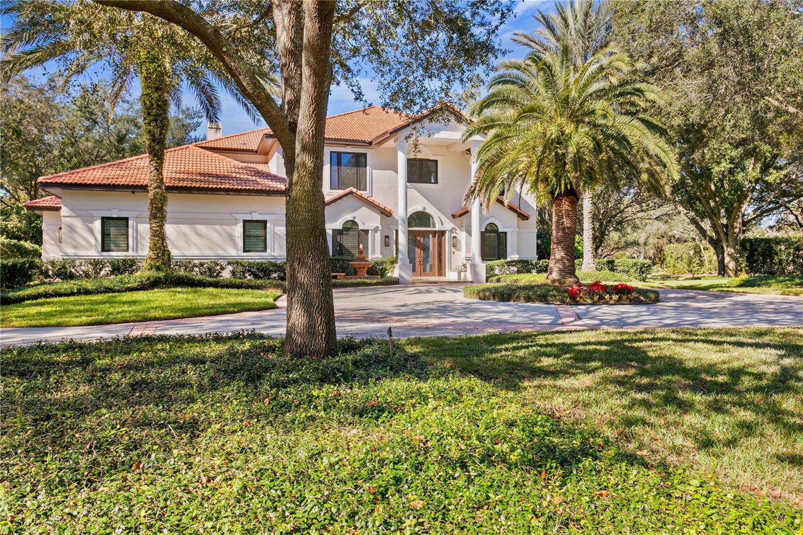 Welcome to this exceptional residence in Avila, Tampa Bay's premier guard-gated golf and country club community. Beautifully remodeled throughout, this stunning home combines timeless elegance with modern comfort, offering an outstanding opportunity to enjoy one of the area's most sought-after lifestyles. Surrounded by lush, professionally landscaped grounds, the home enjoys a private setting highlighted by a spectacular screened pool, expansive lanai, and inviting outdoor living spaces designed for both relaxation and entertaining. Offering 4,792 square feet of air-conditioned living space, the residence features four bedrooms, including a beautiful first-floor primary suite, three spacious ensuite bedrooms upstairs, a private home office, bonus room, and a three-car garage. A grand foyer welcomes you inside, where rich hardwood floors, a sweeping staircase, and abundant windows fill the home with natural light. The thoughtfully redesigned floor plan creates a seamless flow between the main living areas, making everyday living and entertaining effortless. The chef's kitchen has been beautifully renovated with custom cabinetry, elegant quartz countertops, a large center island with seating, and professional-grade appliances, including a Wolf oven and Sub-Zero refrigerator. Open to the family room, this inviting space is enhanced by a fireplace, custom wet bar, and French doors that extend the living space to the outdoor oasis. The first-floor primary suite is a peaceful retreat, featuring French doors that open to the pool and lanai. The beautifully renovated spa-inspired bath offers dual vanities, a soaking tub, an oversized walk-in shower, and spacious walk-in closets. Upstairs, you'll find a generous bonus room with a private balcony, currently serving as both an exercise room and media space. Three additional ensuite bedrooms, each with its own beautifully updated bathroom, provide exceptional comfort and privacy for family and guests. The outdoor living spaces are equally impressive, featuring an oversized screened lanai, a beautiful swimming pool, and multiple areas for lounging, dining, and entertaining. Whether hosting friends or enjoying a quiet evening at home, this outdoor retreat offers the very best of Florida living. Experience the security, privacy, and exceptional lifestyle that make Avila one of Tampa Bay's most desirable communities. This beautifully updated residence is truly a place you'll be proud to call home.