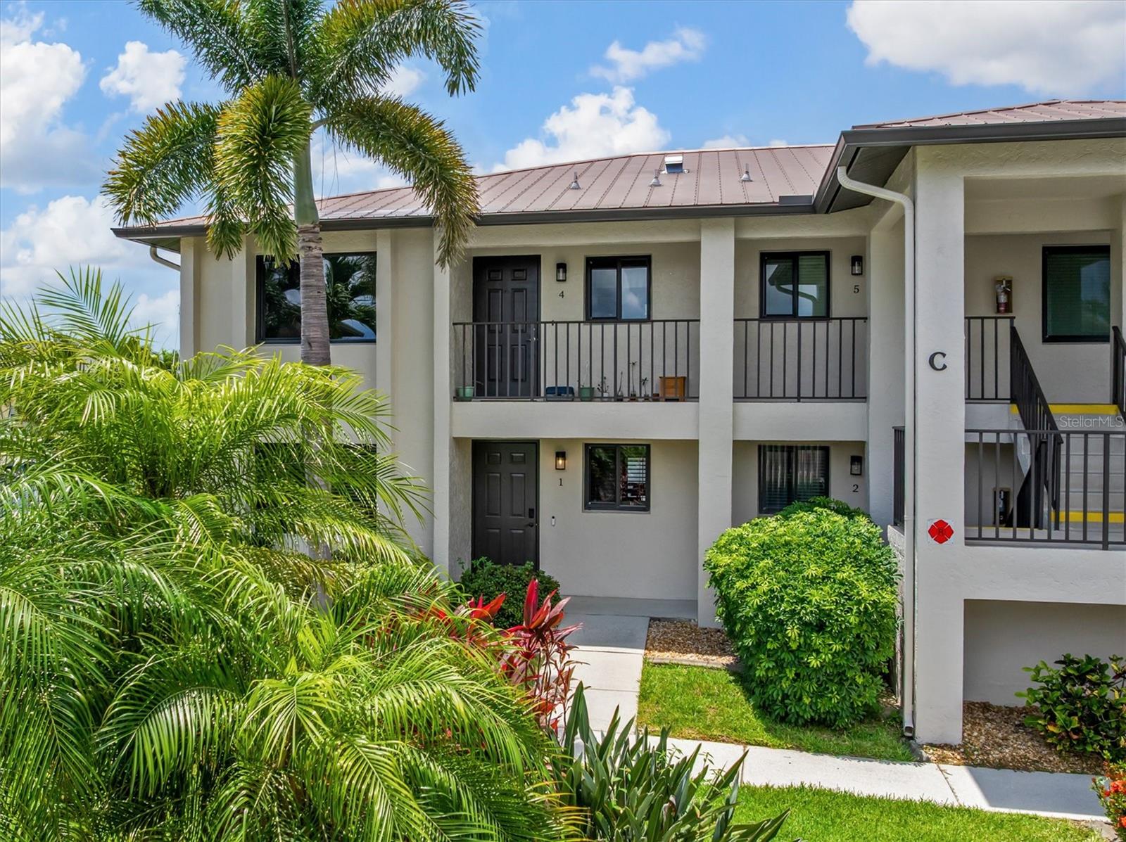GROUND FLOOR| TURNKEY| DEEDED DOCK | SAILBOAT WATER| NO BRIDGES | COMMUNITY POOL
Live the Punta Gorda Isles waterfront lifestyle in this turnkey, ground-floor condo with deeded dock on deep sailboat water along the Wood Thrush Canal. Boaters and anglers will love stepping from their back door to the dock with quick access to Charlotte Harbor and the Gulf, while everyone will appreciate the peaceful canal views and relaxed coastal ambiance. Inside, a bright, open layout with easy-care ceramic  plank tile flooring throughout creates a clean, cohesive look that complements the coastal décor. The updated kitchen features a stainless steel Maytag appliance suite and ample storage, making everyday cooking and entertaining a breeze. Cat 5 hurricane impact windows deliver excellent storm protection, energy efficiency, and true lock-and-leave confidence for seasonal residents and investors. A screened lanai extends the living space outdoors, ideal for morning coffee and evening cocktails by the water. Practical perks include assigned parking right out front and a prime location next to the community pool for a resort-style feel. The 5-star location is just minutes to Punta Gorda Airport, vibrant historic downtown Punta Gorda, and the shops and restaurants of Bal Harbor, putting dining, entertainment, and travel within easy reach. This flexible condo works beautifully as a full-time home, seasonal getaway, or income-producing investment thanks to strong rental history, deeded dock, and pet-friendly policy allowing one medium-sized dog.