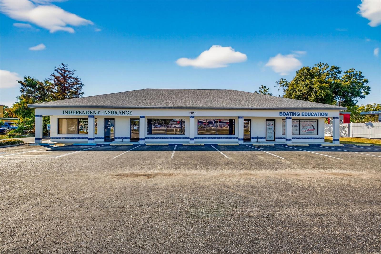 Excellent opportunity to acquire a ±4,000 SF Class B stand-alone commercial office building located on high-traffic San Carlos Blvd in a rapidly growing Fort Myers corridor. The property sits on an oversized lot exceeding 30,000 SF, offering ample on-site parking, strong street visibility, and convenient access. The building is divided into four individual office suites, providing flexibility and diversification of income. Suites one and two are occupied by the current owners, who operate an established insurance business and will remain in place as tenants after the sale, providing stable, immediate income for a buyer. The third suite is vacant, allowing for upside through lease-up or owner occupancy. The fourth suite is occupied by a long-term boating company tenant, adding additional in-place income. Zoned C1A, the property supports a wide range of professional and commercial uses. The location is a major highlight, positioned along a well-traveled commercial corridor and surrounded by a strong mix of national and regional traffic generators, including major retailers, service providers, and destination businesses that drive consistent daily activity. Nearby anchors such as big-box retail, grocery, hardware, and service-oriented centers contribute to sustained visibility and tenant demand in the immediate area. The property also benefits from strong daily traffic counts, excellent frontage, and significant ongoing residential and commercial growth throughout the surrounding trade area, enhancing both near-term income potential and long-term appreciation. This is a well-positioned asset ideal for an investor seeking a partially stabilized property with upside, or an owner-user looking to occupy space while benefiting from existing rental income.