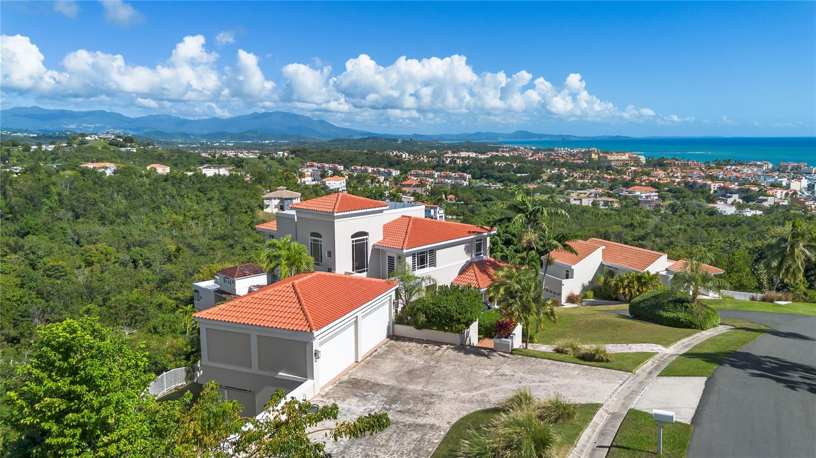 Welcome to Your Sanctuary in Palmas Del Mar

Experience luxury living where nature meets sophistication in this magnificent coastal home nestled within one of Puerto Rico’s most desired communities. Port Road #7 offers an unparalleled lifestyle with breathtaking panoramic views of the Caribbean Sea, the Island of Vieques, and the lush El Yunque tropical rainforest. 

Key Features:
- Unmatched Views: Wake up to jaw-dropping ocean and mountain views from every room, with the master bedroom and guest room offering particularly stunning vistas.
- Lush Garden Paradise: Enjoy an expansive, flattened lot perfect for gardening enthusiasts, featuring fruit-bearing trees such as bananas, avocados, mangoes, pomegranates, coconuts, moringa, and dragonfruit.
- Health and Wellness Retreat: Stay fit and rejuvenated with a private mini gym and a fully automated cold plunge designed for ultimate relaxation.
- Creative and Private Workspace: A detached office space offers a serene environment for work or creativity, doubling as a guest room with a pull-out couch.
- Safety and Modern Comfort: Hurricane doors and a fresh coat of paint (June 2024) enhance both security and elegance.
- Eco-Friendly Living: Solar water heater (installed within 15 months) and a monthly serviced generator ensure sustainability and preparedness.
- Chef’s Delight Kitchen: A beautifully designed kitchen featuring granite countertops, a massive Sub-Zero refrigerator/freezer, and an expansive island serves as the centerpiece of the main level.
- Practical Luxuries: Includes ample storage, a fenced backyard, a spacious two-car garage, and a welcoming driveway.
- HOA: $1,300/year

Elegant Interior Layout:
4 Bedrooms and 3.5 Bathrooms inside (plus an outdoor half bath).
Bright and airy living spaces with travertine floors, marble and granite countertops, and solid wood cabinets.
Two family rooms, dining room, and spacious living areas perfect for entertaining or relaxing.

Pre-approved buyers or cash buyers are invited to schedule a private showing to experience this rare coastal dream home firsthand.