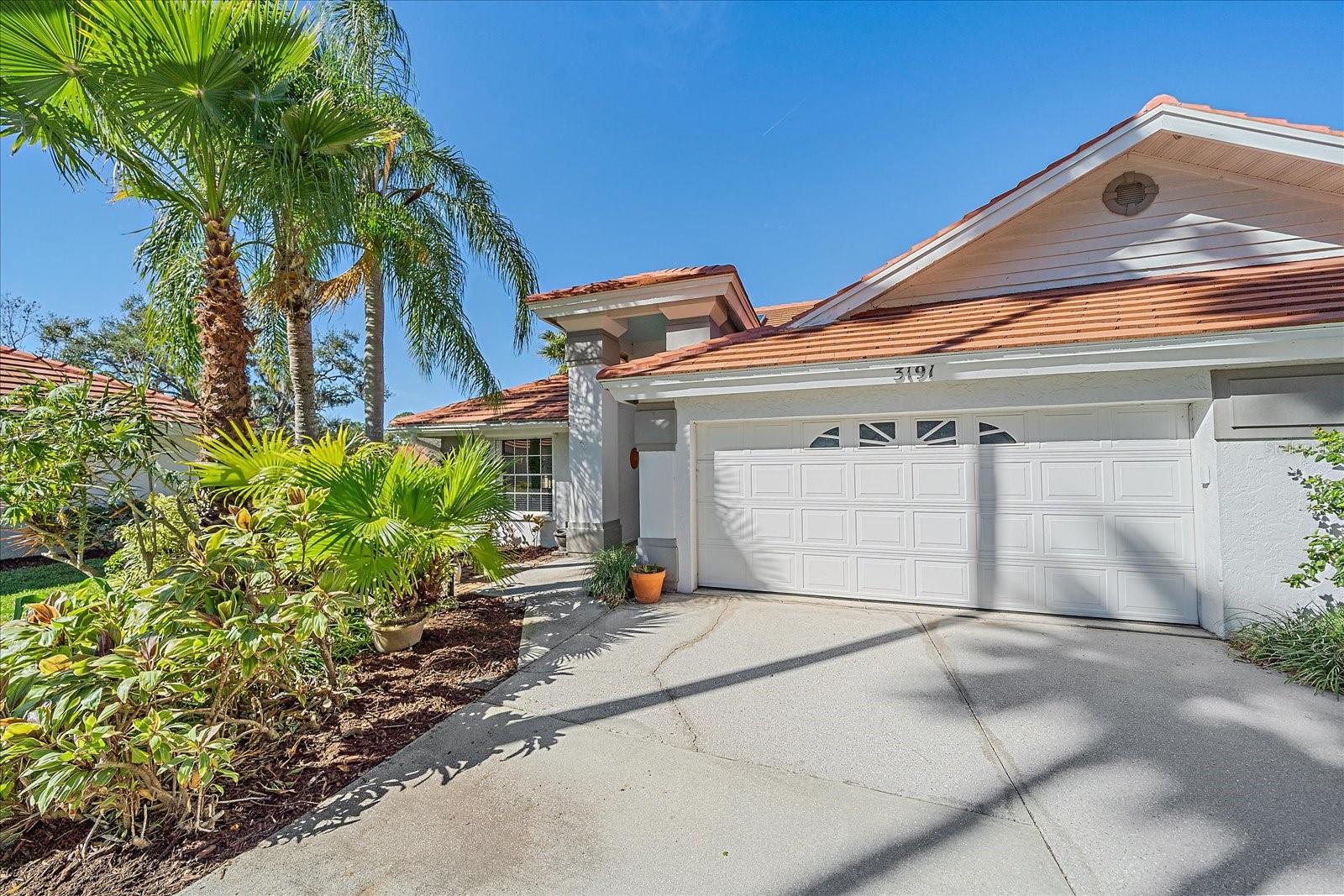 One or more photo(s) has been virtually staged. PRICE IMPROVEMENT! You will discover comfort, style, and Florida living at its best in this beautifully maintained 2-bedroom, 2-bath villa perfectly situated in central Sarasota - just minutes from the area's pristine beaches, vibrant downtown shopping, and fine dining options.
As you enter the home, you are welcomed by a light and bright interior featuring soaring vaulted ceilings, skylights, and an inviting open layout that enhances the spacious feel. A new tile roof (2023) and new A/C system (2025) provide peace of mind and year-round comfort. The living area opens to a relaxing lanai with impact-resistant sliders where you can unwind while taking in the serene lake view and lush, mature landscaping. Two charming bay windows also offer picturesque water views, filling the home with natural light. The primary suite offers a tranquil retreat with stylish LVP flooring, a custom closet system, and an ensuite bathroom with multiple grab bars and zero entry shower.
Whether you're seeking a seasonal getaway or a year-round residence, this lakefront villa offers the perfect blend of convenience, beauty, and low-maintenance living - all in one of Sarasota's most desirable locations.