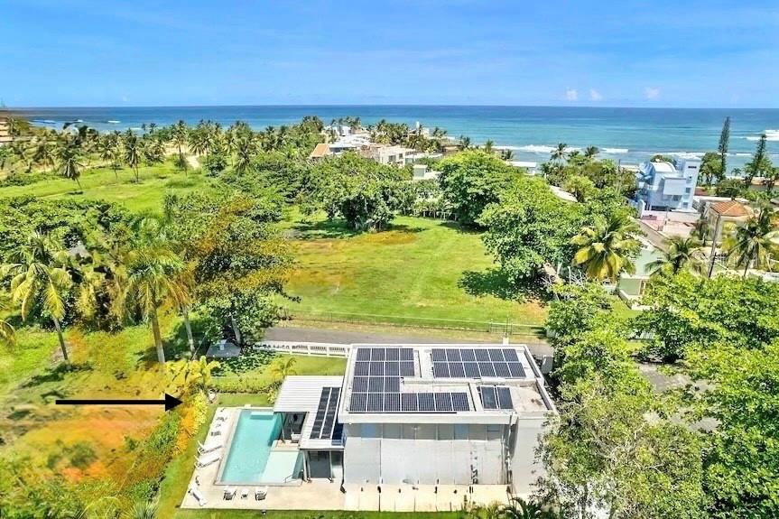 Enjoy living in your own resort, a house with a magnificent heated pool, its own pickle ball court and steps to a splendid very private beach! Experience unparalleled tropical ocean side living within this Dorado gated beachfront community where you can delight in this beautiful crescent cove and practice all kinds of beach amenities while living in a very peaceful oasis.  The property features a totally renovated 5 bedroom house with an open layout of the living and dining areas next to a custom made chef’s kitchen, all flowing into the covered terrace and fabulous heated large salt water pool next to the perfectly designed pickle ball court. The home is surrounded by beautifully landscaped gardens and perfectly located in a cul de sac, adjacent to the old Cerromar Hotel (which is now owned by the Dorado Beach resort). This unique residence comes completely furnished by an interior designer. It also has a family room, gorgeous floor porcelain tiles, an ample master bedroom with a large master bath. There are 4 other spacious bedrooms in the second floor, 4 baths, 1 half bath and custom made closets in every bedroom. The guest suite has its own entrance in the first floor. The residence also has a storage shed, solar panels plus an additional diesel generator, a cistern, a solar water heater, top of the line appliances and equipment. 
Breñas Estates is an enclave boasting a unique picturesque very private large cove.  It features a gated community with 24 hour security guard, nestled on a secluded beach near the Dorado resort. The beach is protected by a natural reef in which you can engage in numerous aquatic sports such as surfing, paddle board, kitesurfing, scuba diving, kayaking, swimming or just sunbathing on the sand. A real jewel!