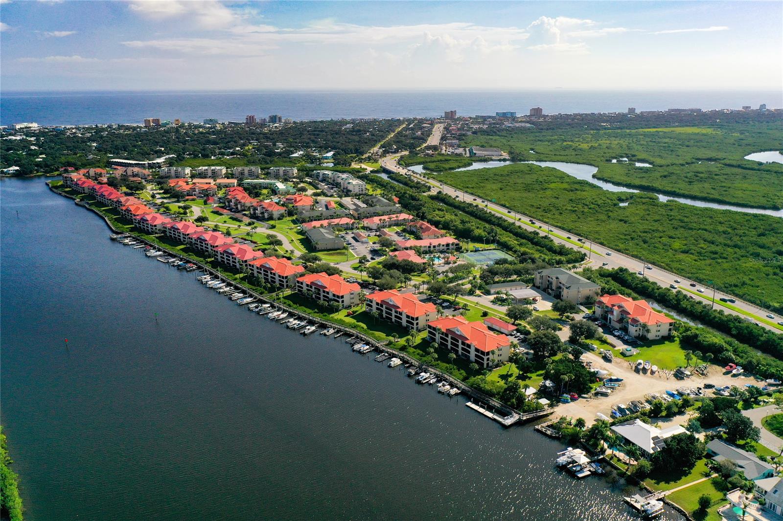 Your Island, Your Terrace, for You to Relax & Enjoy from Your Direct Riverfront Top Floor Location.  Breathe in the Fresh Air, Feel the River Breezes, Hear the Sounds of the Birds & Dolphins Playing, Watch the Ever Changing Colors of  Sunset & the Serene Activity on the Intracoastal River.  All can be Enjoyed from Your Entry, Kitchen, Dining Room, Living Room, Master Bedroom & Your Spacious 24 x 9 foot Screened Terrace.  Amenities abound on Beautifully Landscaped Bouchelle Island; 1/2 mile Riverwalk, Wet & Dry Boat Slips for Rent, Private Boat Launch, Clubhouse, 2 Pools, Tennis Courts, 18 Hole Chip & Putt Course & Dry Storage for Boats & Kayaks.  Two Bedroom, Two Bath Condo has High Catherdral Ceilings, is Clean & Ready for You to Move Into. ;LocationDescription: Condo ;Water: City