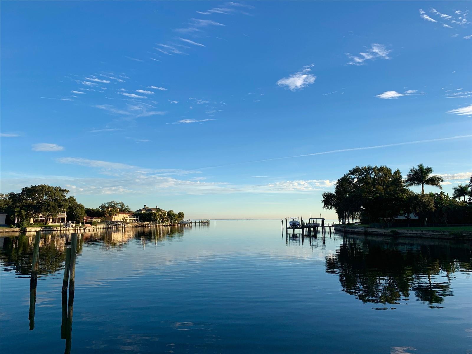 Remodel or Build Your Dream Home! This spectacular property is being sold for land value. You will be stunned by the view! Hurricane Helene has created the perfect opportunity for you to build your dream home. The lot features 75' of water frontage and is 146 feet deep, creating a lot with 10290 square feet for your dream home! Save money on your construction costs with the seawall, dock, and pool complete. Three-tiered seawall plus riprap protects the property. The pool and dock were remodeled in 2018.  Brightwaters Boulevard is the premier street in St. Petersburg! New construction waterfront homes along this street have recently sold for $9,000,000 - $13,000,000.  Zoned Neighborhood Suburban for Single Family construction. Side setbacks = 7.5', front setback = 25' (17' to the front of stoop), rear setback = 15' from the center of the seawall. All zoning and building information can easily be accessed at www.stpete.org

The current home features 4 bedrooms, all ensuite, tile floors throughout, hurricane impact doors and windows, a new roof and solar panels.