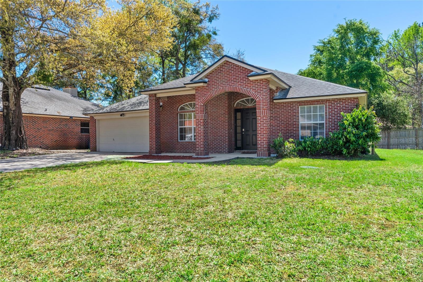Brick, cul-de-sac home near NAS has freshly Painted neutral interior and notable updates include: Whole Home Water Softener, New HVAC systems installed in 2022, Roof 2019. SOLAR PANELS will be PAID OFF with accepted offer. Propane tank for Gas Stove, fireplace and water heater was filled by AmeriGas! BRICK home with NAS/Cecil Field close by with VA ASSUMABLE option. The timeless brick exudes curb appeal, inviting you into a thoughtfully designed interior. The spacious floor plan seamlessly connects the living areas, providing an ideal setting for both relaxation and entertaining. The well-appointed kitchen features modern appliances and ample counter space, catering to culinary enthusiasts who love GAS RANGE/STOVE especially. Primary bedroom offers a tranquil retreat with an en-suite bathroom, while three additional bedrooms provide flexibility for guests. The 4th could be a nonconforming bedroom, home office or flex space. For those cold evenings enjoy the gas fireplace and opportunity to host guests on the front porch or back patio..

Situated in a prime location with convenient access to Downtown, nearby shopping centers, grocery stores! Public Kayak launch is in close proximity to the home. ASSUMABLE RATE 5.5%. *Irrigation System does not work and is "AS IS", Washer/Dryer convey "AS IS" and seller will not repair those items.