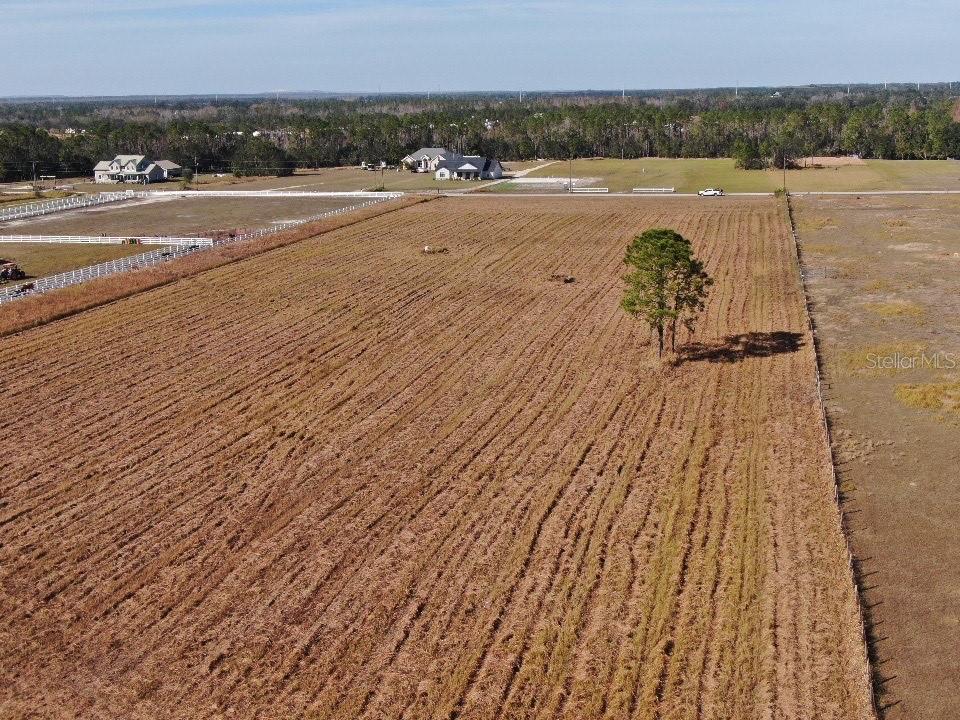 Discover the perfect setting to build your custom dream home on this beautiful 6.74-acre parcel of cleared land. This property is ready for your vision with electricity and a private well installed in 2022.

Enjoy the freedom of country living with no HOA and no mobile or manufactured homes permitted, helping preserve the area's character and appeal. Bring your boat, RV, recreational toys, and animals, and experience the space and privacy that Florida living is all about.

The well, completed on July 29, 2022, features a 4-inch well, 1.5 HP submersible pump, 1.5 HP control box, and an 86-gallon pressure tank, providing a valuable improvement already in place for your future home.