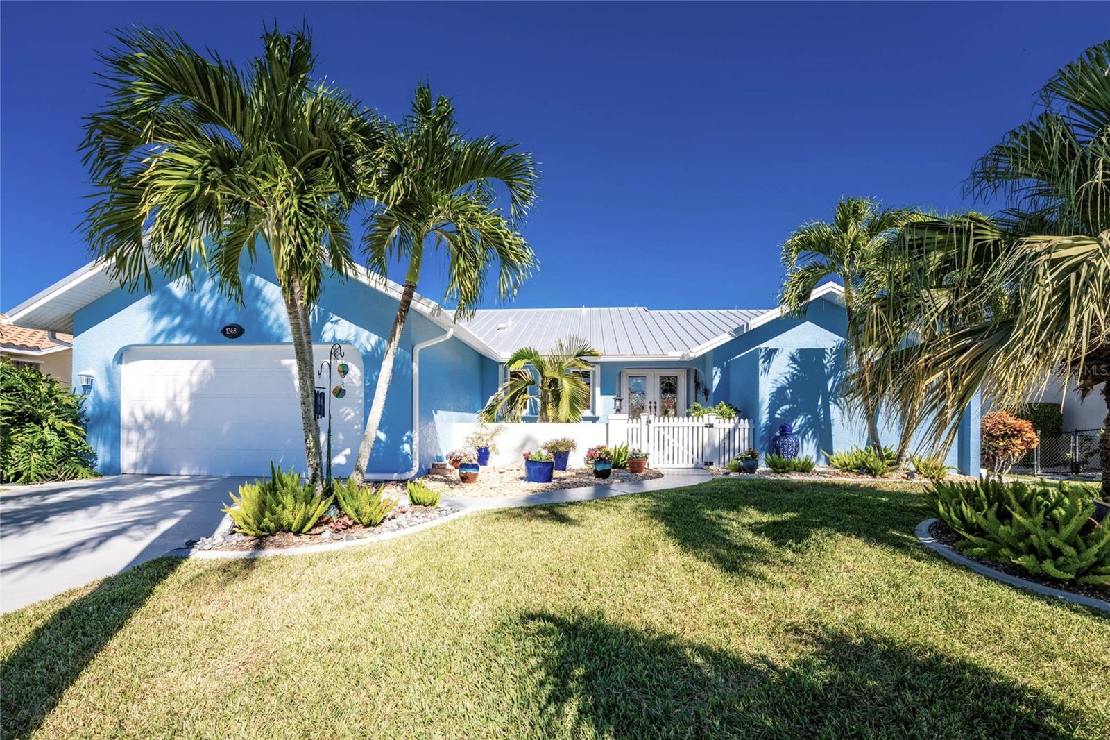 WHERE COTTAGE CHARM MEETS COASTAL LIVING This meticulously kept modernized 3-bedroom, 2-bath cottage gem seamlessly blends timeless coastal charm with modern luxury, overlooking a beautiful intersecting waterway with STUNNING SUNRISES EVERY DAY AND SUNSETS during the summer months—a rare feature that makes this inviting 2109 sqft waterfront retreat truly one-of-a-kind.
The unique floor plan creates distinct spaces for every occasion. The home flows from room to room with pocket sliding doors that seamlessly capture the beauty of tropical living. A cozy sitting room offers intimate conversations, while the private dining room sets the stage for memorable gatherings. Custom finishes throughout the home are thoughtfully designed to complement the exceptional boating lifestyle that awaits you... This is the perfect launching point for some of the best inshore snook, redfish, and tarpon fishing, which has earned a world-class reputation. With your boat docked outside your door, you can spend your days island hopping through the pristine Gulf Islands of Charlotte Harbor. Just 20 minutes to Charlotte Harbor via the Buckley Pass, endless adventures await. It's your direct access to some of America's finest cruising grounds, Charlotte Harbor, named # 10 by Sail Magazine—protected mooring with excellent depth, seawalls owned and maintained by the City—no bridges between you and open water. Launch at dawn for Boca Grande Pass, anchor off Cayo Costa by lunch, return with the evening breeze—weekend trips to Captiva and Sanibel. Whether you're seeking a year-round residence, a winter escape, or a boater's dream home, this waterfront gem offers the perfect balance of relaxation and adventure by land and sea.
WHERE EVERY DAY BEGINS With a STUNNING SUNRISE ON THE WATER EDGE. Your Coastal Paradise Awaits. THE SUNRISE IS WAITING. THE ONLY QUESTION IS: WILL YOU BE THERE TO SEE IT? PREMIUM FEATURES AND CAPITAL IMPROVEMENTS:2023 -24 -Gauge Standing Seam Metal Roof. Modernized Kitchen And Bathroom. Level 3 Granite Kitchen Counter. Designer Porcelain Tile Floors. Plush Carpet. Custom Built Entertainment Center. Faux Painted Accent Walls. Solid Wood Master Bathroom Cabinets. Level 4 Granite Bathroom Counter. Floor-To-Ceiling Porcelain Tile Shower With Built-In Shelves. Seamless Glass Shower Door. Vessel Sink Accordion Storm Protection Shutters. 2023 Pool Pump. Pool Deck Resurfaced. 2024 Painted -Interior, Exterior, And Garage. 2025 Air Conditioner. 2022 Mitsubishi Mini Split. 2022 62 Galloon Rheem Water Heater. 2025 Bosch Dishwasher. 2014 Samsung Refrigerator. Slider Glass Door Vertical Sliders. 2024 Overhead Plumbing. Plantation Shutter.Big Blue Whole-House Water Filtration System.2025 Stamped Concrete Pool Deck Refinished