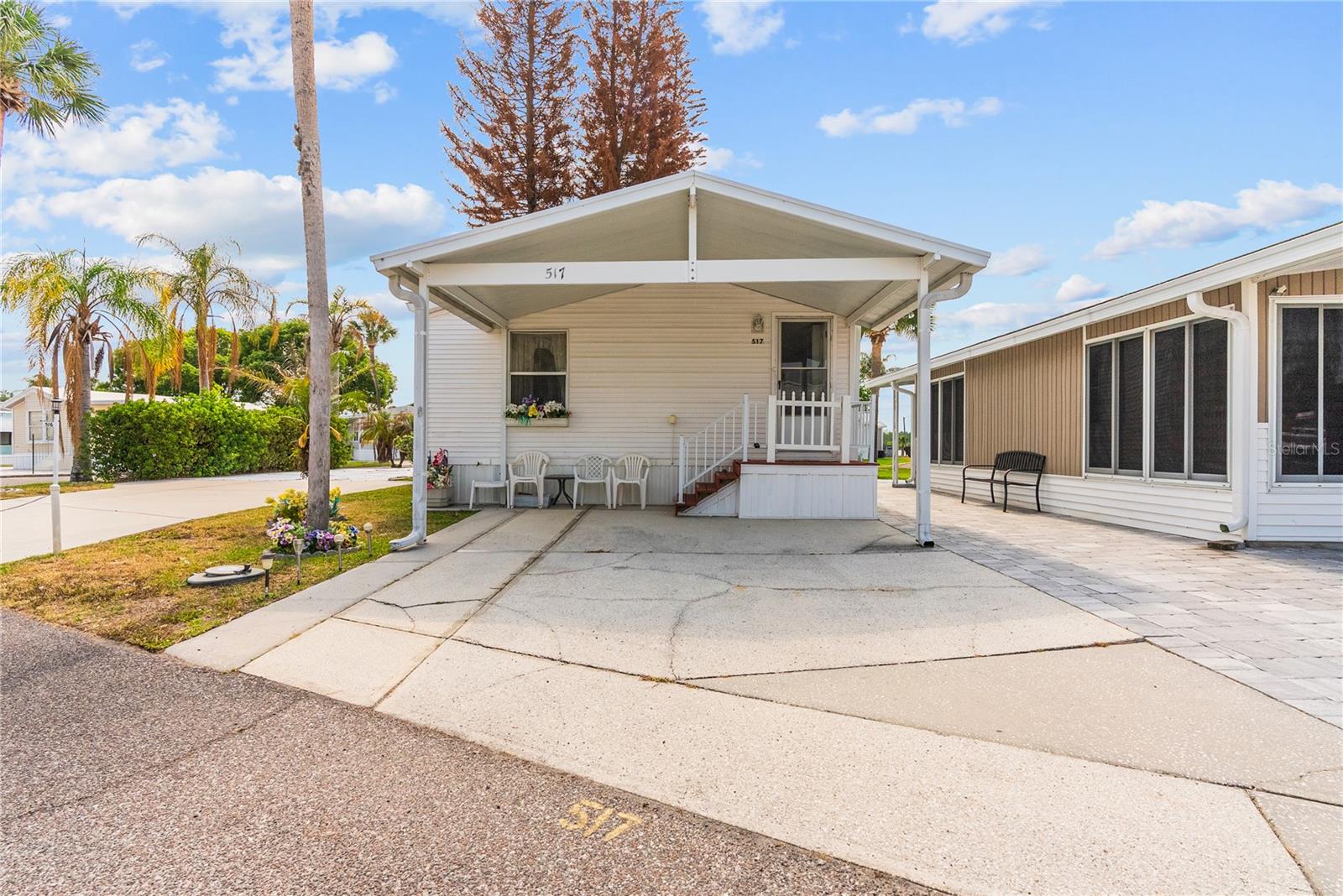 Charming 1-bedroom, 1-bathroom single-level mobile home ideally positioned within Outdoor Resorts of Orlando, offering beautiful views of the clubhouse, golf course, and lake—all just a short stroll from the community’s exceptional amenities.  This well-located home enjoys added privacy with no immediate rear neighbors, creating a peaceful setting and extra space to relax or entertain outdoors. The layout is both functional and flexible, featuring a bonus room with a closet that can easily be converted into a second bedroom with its own external access—perfect for guests or added rental potential.  Outdoor Resorts of Orlando is known for its vibrant, amenity-rich lifestyle, offering residents access to a 9-hole golf course, mini golf, tennis courts, shuffleboard, multiple swimming pools, and a lively calendar of in-park activities.  Located less than 15 minutes from world-renowned theme parks, as well as close to major highways, shopping, and dining, this property combines convenience, location, and opportunity.  Whether you're looking for a winter getaway, investment property, or full-time Florida retreat, this home offers the perfect chance to enjoy the relaxed resort lifestyle.  Come and experience the best of Florida living.