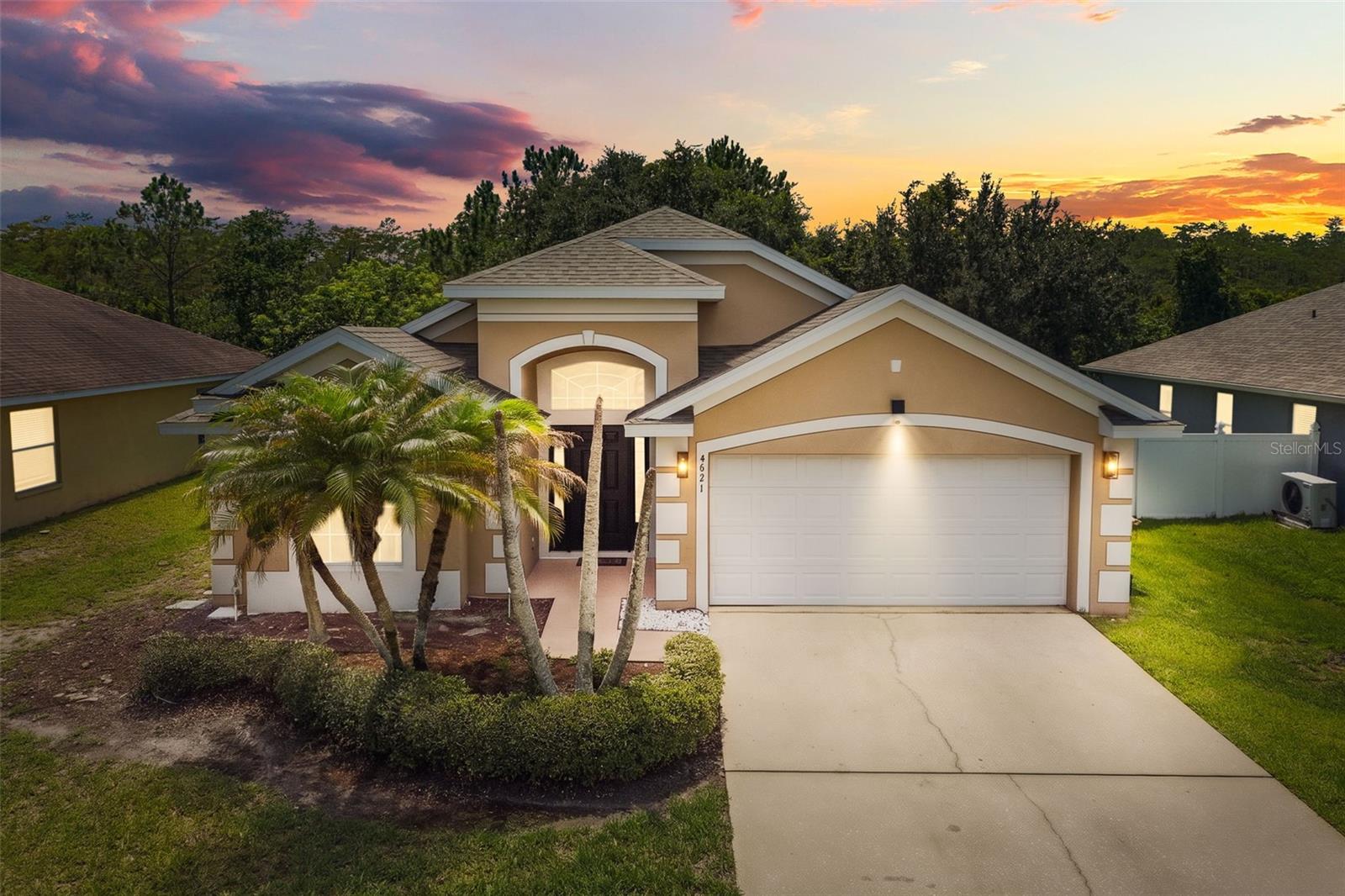 Welcome to this beautifully updated 3-bedroom, 2-bath home located in the sought-after Turnberry Reserve community in Kissimmee! Thoughtfully upgraded and move-in ready, this home combines modern finishes with comfortable living in one of the area's most convenient locations. Step inside to discover soaring ceilings, an open and airy split floor plan, and gorgeous 2023 luxury vinyl plank flooring flowing throughout the main living areas. The heart of the home is the fully remodeled kitchen (2023) featuring crisp white cabinetry, stainless steel appliances, updated fixtures, a center island, and a spacious breakfast bar that opens seamlessly to the dining rooms—perfect for entertaining. The expansive living room offers a custom designer feature wall with a modern electric fireplace, floating wood shelves, and built-in bench with storage/seating, creating a warm and inviting focal point. Large windows and sliding glass doors bring in abundant natural light while showcasing the outdoor living spaces. Retreat to the spacious primary suite with a private en-suite bath, while two additional bedrooms provide flexibility for family, guests, or a home office. Outdoor living is where this home truly shines. Enjoy the oversized screened-in rear lanai, ideal for relaxing or entertaining year-round, plus the rare bonus of a second screened-in side porch, offering even more outdoor space for morning coffee, a reading nook, or additional seating. For added peace of mind, this home has been thoughtfully updated with a new A/C installed in 2025, a roof replaced in 2022, a beautiful kitchen remodel completed in 2023, and luxury vinyl flooring installed throughout the main living areas in 2023, allowing the next owner to move in with confidence. Residents of Turnberry Reserve enjoy resort-style amenities including a community pool, clubhouse, fitness center, and playground, all with easy access to Lake Nona, Orlando International Airport, Medical City, major highways, shopping, dining, and Central Florida attractions. This beautifully updated home offers style, functionality, and exceptional value—schedule your private showing today!
