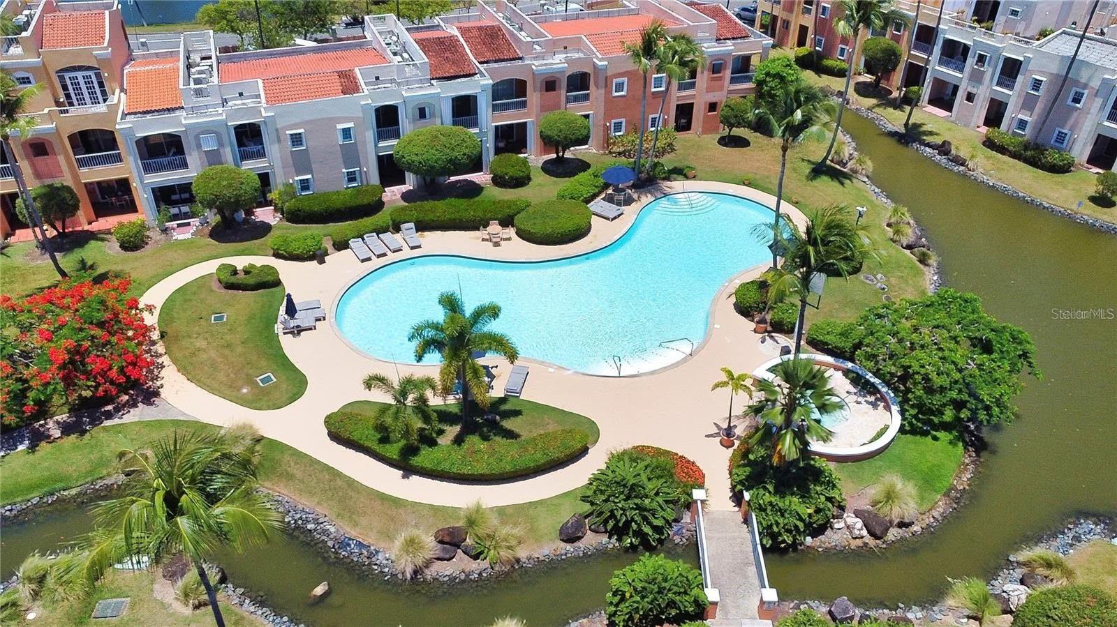 Enjoy the convenience and lifestyle of Palmas del Mar in this furnished and fully equipped 2-bedroom, 2-bathroom, garden-level corner-unit residence in the desirable Fairway Courts community. Relax with the serene pond/fountain view from the patio.

Designed for comfortable island living, the unit features an open-concept layout, spacious living and dining areas, and split-unit air conditioning in both bedrooms and the living room for year-round comfort. Offered fully furnished and equipped, this property is ready for immediate enjoyment as a primary residence, vacation home, or investment property.

The residence includes two assigned parking spaces plus a dedicated golf cart parking space, making it easy to take advantage of all the Palmas del Mar lifestyle. Fairway Courts is a guard-gated community with a residents' swimming pool and convenient access to golf courses, beaches, restaurants, marinas, tennis and pickleball facilities, and miles of walking and biking paths.

Whether you're seeking a full-time residence or a low-maintenance Caribbean getaway, this move-in-ready home offers comfort, convenience, and access to one of Puerto Rico's premier resort communities.