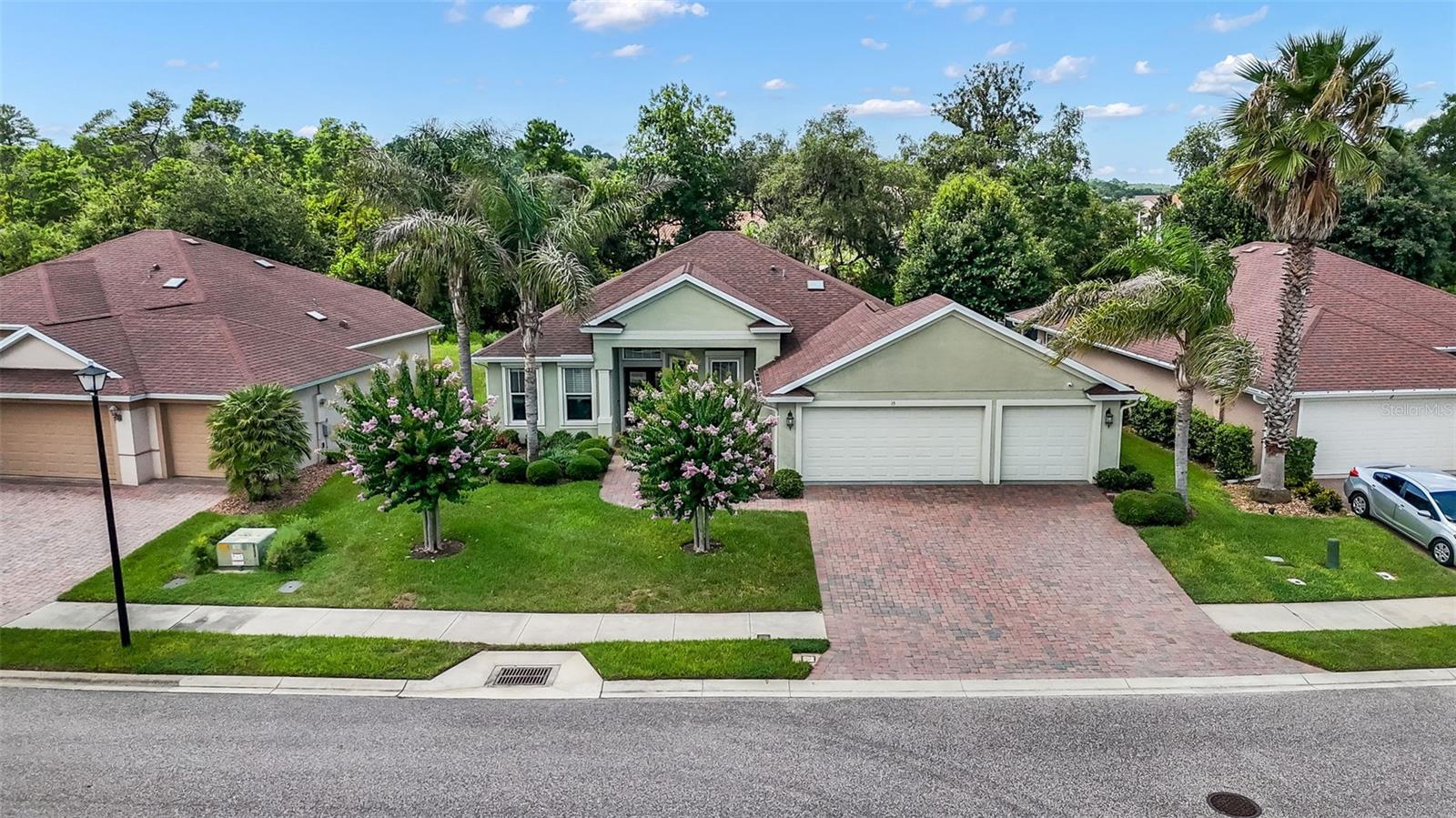 Welcome to 15 Arena Lake Drive, a beautifully finished Paytas-built home in the desirable Hidden Lakes community, built in 2017. From the moment you arrive, the paver driveway, oversized 3-car garage, and manicured landscaping create strong curb appeal. Inside, high ceilings throughout with beautiful tray features, and crown moldings elevate the main living areas, giving the home an open, upscale feel. The layout offers a generous great room, a dedicated dining area for gatherings, and a large office that’s ideal as a true workspace, flex room, or den.

Thoughtful design continues with a split floor plan. The primary bedroom is large and has a private entrance to the rear lanai. The primary bath features a large walk-in shower, and his/hers sinks.  Step out to the covered lanai patio and enjoy a well-kept backyard and Florida evenings in a peaceful neighborhood setting.

Hidden Lakes offers a true community lifestyle with a resort-style pool, children’s playground, park-like common areas, sidewalks, and a well-run HOA with modest fees. All of this comes with quick access to Town Center, shopping, restaurants, medical facilities, and Flagler Beach just minutes away. 15 Arena Lake Drive combines modern finishes, functional spaces, and amenity-rich living in one move-in ready Palm Coast home.
