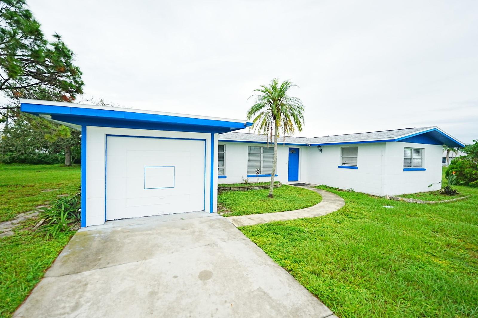 House In Port Charlotte - in the perfect, quiet location, close to schools, shopping with a grocery store and shopping plaza, many restaurants nearby,  and a short drive up to Charlotte Beach.  
NO RENTAL RESTRICTIONS.  No HOA. NO FLOODING.

This is a 1,232 square foot house on a 10,399 sq/ft lot with 2 bedrooms and 2 bathrooms, one car garage, city water and sewer. 
BRAND NEW ROOF!
One of two lanais is completely closed, has an AC, and can be used as an additional room/room for guests.
Schedule your private showing today.