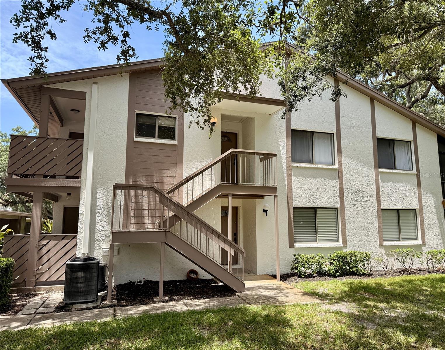 Beautifully remodeled 2-bedroom, 1-bath second-floor condo in one of the most convenient and coveted locations within the Yorktown community nestled in pristine Safety Harbor.
This bright and tastefully updated home features a brand-new kitchen with quartz countertops, modern appliances, and an ample pantry, plus fresh paint throughout, ash-wood luxury vinyl plank flooring in the living areas, and matching Spanish porcelain tile in the kitchen and bath. Featuring all-new fixtures and interior doors (including closets). Oversized windows flood the space with natural light while offering peaceful views of trees, newly updated swimming pool, and the clubhouse overlooking a pristine pond fringed by cypress trees.
Step outside to enjoy Florida living on your covered front porch or spacious screened rear porch—perfect for morning coffee or evening relaxation. Residents love the prime location, with easy walking or cycling access to Philippe Park, and vibrant downtown Safety Harbor (shops, dining, breweries, family owned cafes and bakeries, live music and events, etc).

Yorktown is a welcoming, non-age-restricted community where leasing is allowed. Two small pets (under 25 lbs) are welcome, and the proactive HOA delivers outstanding value—covering water, sewer, trash, cable, high-speed internet, exterior maintenance and insurance, landscaping, pool, and clubhouse—while keeping everything pristine with weekly grounds care, fresh building repaints, and fresh asphalt paving.
Turn-key and move-in ready!