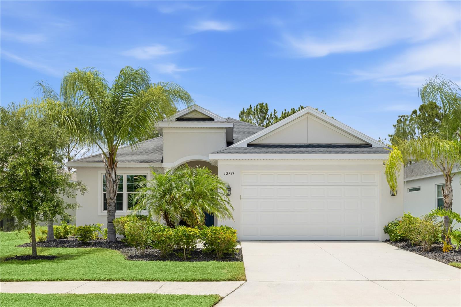 Welcome to this beautifully appointed coastal-inspired home featuring HURRICANE IMPACT WINDOWS and DOORS throughout, offering exceptional storm protection, energy efficiency, and peace of mind. Designed with an open-concept floor plan, this residence seamlessly blends luxury, comfort, and effortless Florida living with spacious living areas filled with natural light and thoughtful upgrades at every turn. The gourmet kitchen is a chef's dream, featuring stunning quartz countertops, stainless steel appliances, a gas range, upgraded fixtures, and ample space for gathering with family and friends.The dedicated office showcases luxury vinyl plank flooring, while tile flooring extends throughout the main living areas and primary suite for both style and durability.The spacious primary suite serves as a private retreat, complete with a large walk-in closet and a luxurious en-suite bath featuring dual vanities, quartz countertops, and an oversized walk-in shower. The split floorplan offers two more bedrooms and a bathroom with quartz counters on the other side of the home. Pocket sliding glass doors open completely to the lanai, creating the ultimate indoor-outdoor entertaining experience and allowing you to fully embrace Florida's year-round lifestyle. Additional upgrades include 8-foot interior doors throughout making the home feel extra open and grand and a built-in indoor/outdoor speaker system, perfect for entertaining both inside and out. Step outside to the backyard oasis featuring a resort-style, heated, salt water pool surrounded by mature landscaping that provides privacy and a serene atmosphere. The home is also pre-plumbed for an outdoor kitchen. Whether enjoying a quiet evening by the pool or entertaining, this outdoor retreat is designed for relaxation and enjoyment. Cross Creek offers resort style amenities including cable and internet, a clubhouse, community pool with water slide, splash pad, playground, dog park and walking trails all included in the hoa. The community is just minutes from Parrish's medical offices, shopping, dining, golf, nature trails, and just down the road from the Ft Hamer bridge for quick access into Lakewood Ranch and the pristine Gulf Coast beaches.
