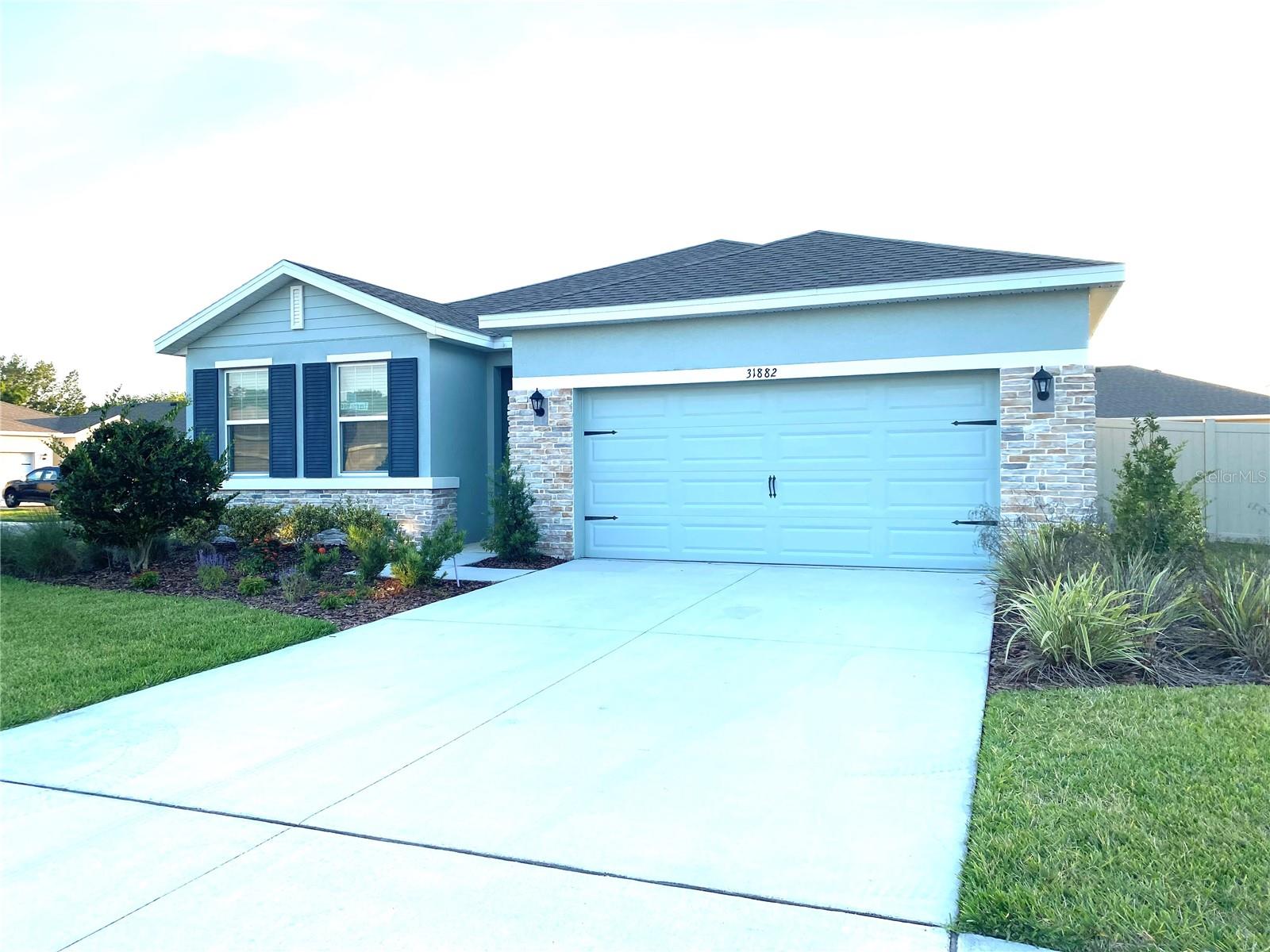 Built in 2019, this gorgeous 4-bedroom, 2-bath home is located in the private gated section of the highly sought-after Epperson Ranch Crystal Lagoon community. Situated on an oversized, fully fenced corner lot, this home offers plenty of indoor and outdoor living space, along with a spacious 2-car garage. This one-story floor plan features many builder upgrades, including staggered 36” premium cabinets with crown molding, granite countertops with a 4” backsplash, a granite kitchen island with an undermount stainless steel sink, and a huge walk-in pantry. Additional features include 9’4” ceilings throughout and 18” ceramic tile flooring in the foyer, living areas, bathrooms, and laundry room. The bathrooms also include granite countertops and raised premium cabinets, while the primary bathroom features a deluxe tiled shower with a built-in shower seat. Epperson is part of the premier Connected City and includes high-speed fiber internet in every home, which is included in the HOA fee paid by the landlord. Residents also enjoy access to Florida’s first residential Crystal Lagoon, featuring 7.5 acres of resort-style fun with swimming areas, relaxing beach spaces, kayaking, paddleboarding, yoga, Pilates, karaoke, movie nights, walking trails, biking paths, and golf-cart-friendly areas. With easy access to I-75, Downtown Tampa, the Gulf beaches, and Orlando are all within reach. Tampa Premium Outlets and The Shops at Wiregrass/Grove area are also just minutes away. Call today to schedule your private showing. This one won’t last!