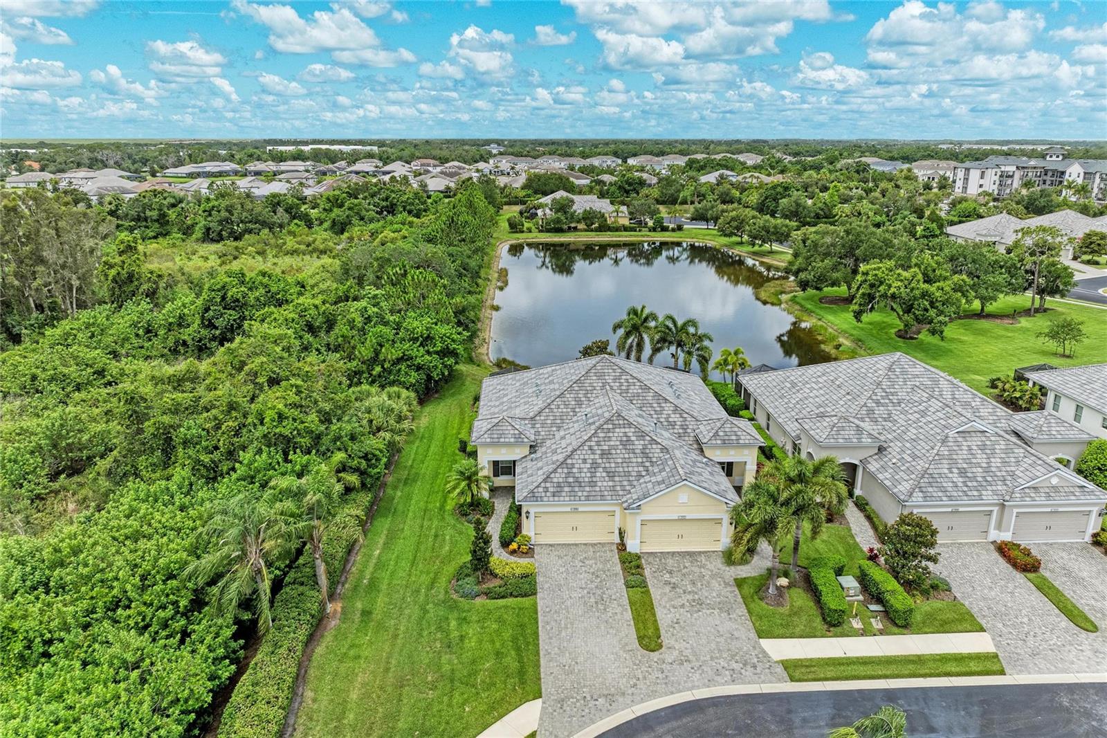 Virtually Staged. 2BR/2BA Villa in Eagle Trace. Cul-de-sac lot with water and an incredible conservation view. Tile floors, screened lanai, HVAC 2023. No CDD.

Welcome to this 2-bedroom, 2-bath villa in Eagle Trace, a maintenance-free community in Bradenton close to Lakewood Ranch. Positioned on a private end lot  of a cul-de-sac, this 1,422-square-foot home offers peaceful water and conservation views along with thoughtful upgrades that enhance everyday living. With low HOA fees and no CDD fees, buyers will appreciate both the lifestyle and long-term value.

Inside, tile flooring runs throughout the home for a clean, cohesive look and easy maintenance. The kitchen features an upgraded custom pantry cabinet designed to match the existing cabinetry, complete with pull-out drawers and interior lighting for added functionality and storage. The primary suite includes a custom-built closet system, while the second bedroom offers exceptional flexibility with a built-in Murphy bed and desk, making it ideal for guests, a home office, or both.

The screened extended lanai provides a comfortable space to enjoy morning coffee, evening relaxation, or the tranquil water and conservation views. The end-lot location adds privacy and open sightlines rarely found in attached villa living.

Important updates include a new HVAC system installed in 2023, providing added peace of mind. The maintenance-free lifestyle allows more time to enjoy the community amenities and nearby attractions rather than exterior upkeep.

Eagle Trace offers an inclusive community atmosphere with active social events, a resort-inspired amenity package featuring a heated pool and spa, tennis /pickle ball courts, two dog parks, a recreation center, and two natural gas outdoor kitchens. Residents enjoy a convenient location close to shopping, dining, Costco, schools, medical services, and everyday conveniences.

HOA fees are $344.67 a month and there is no CDD fee. If you're looking for a private, low-maintenance home with outstanding conservation and water views, flexible living space, and access to community amenities, this Eagle Trace villa deserves a closer look.