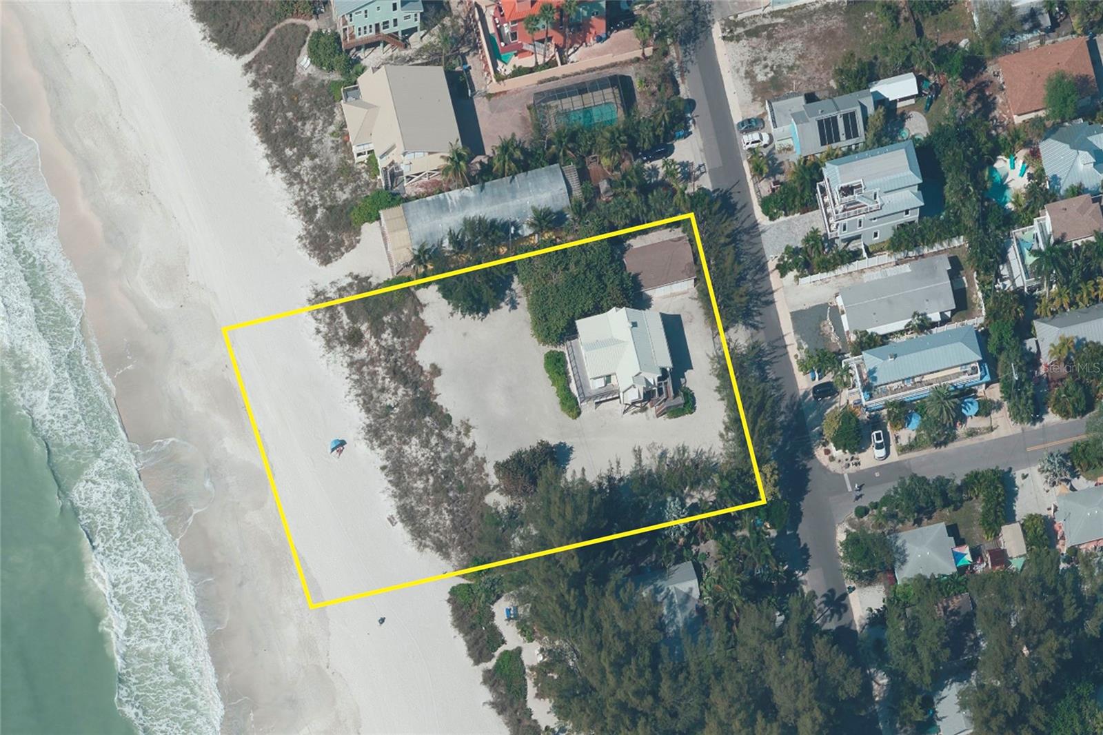 Paradise found in this GULF FRONT HOME with detached garage and guest-suite on an expansive property, primed for the construction of your personalized dream residence! This is a truly exceptional chance to secure multiple Gulf-front lots right in the heart of Holmes Beach. Lots 1, 2, 3, 18, 19, and 20 collectively offer an impressive 174 feet of direct beach frontage, creating an unparalleled coastal retreat. Immerse yourself in the awe-inspiring spectacle of nightly sunsets, accompanied by the rhythmic melody of crashing waves. Conveniently situated near restaurants, shops, and a grocery store, this is more than a property—it's a gateway to island living. Don't delay any further; commence your island living journey today!