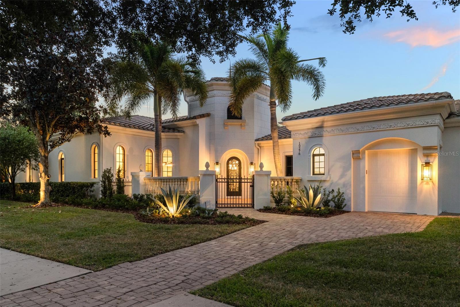 Welcome home to this recently updated and remodeled single story pool home built by ISSA Homes inside the gates of prestigious Lake Nona Golf and Country Club. Situated on a large corner lot, you are steps from the short-game practice facility, the Bath and Racquet Club and the clubhouse. This three bedroom, three and a half bath home overlooks two ponds, one from the front, and one from the backyard. With a recent remodel of the entire interior, this home is simply stunning, boasting an airy and open floor plan. The open chefs kitchen has custom cabinetry, and a spacious eat-in breakfast nook that features French doors that open to the outside to the patio. The kitchen also features two dishwashers, and Dacor and Wolf appliances. No detail has been spared, from the wooden beams in the living room, to the temperature-controlled glass showcase wine racking, this house truly has it all. The master suite has beautiful views of both the pond and the pool, and has a private door to go out to the covered patio. The redesigned closet and bathroom will impress the pickiest of buyers. The two additional bedrooms are separated from the master, and feature their own newly designed bathrooms and walk-in closets. The exterior living space is an extension of the inside, a beautiful covered outdoor kitchen which has a large grill, refrigerator, outdoor cabinets, and even a dishwasher. Additionally, there is an outdoor counter with ample bar seating, wonderful for entertaining. The outdoor lanai seating area also has motorized screens.This home has a spacious 2 car garage, with an additional golf cart garage. The recent remodel included repainting of the entire interior and exterior, all new flooring, all new bathrooms, light fixtures, new countertops and so much more. What are you waiting for? Book your private showing today.