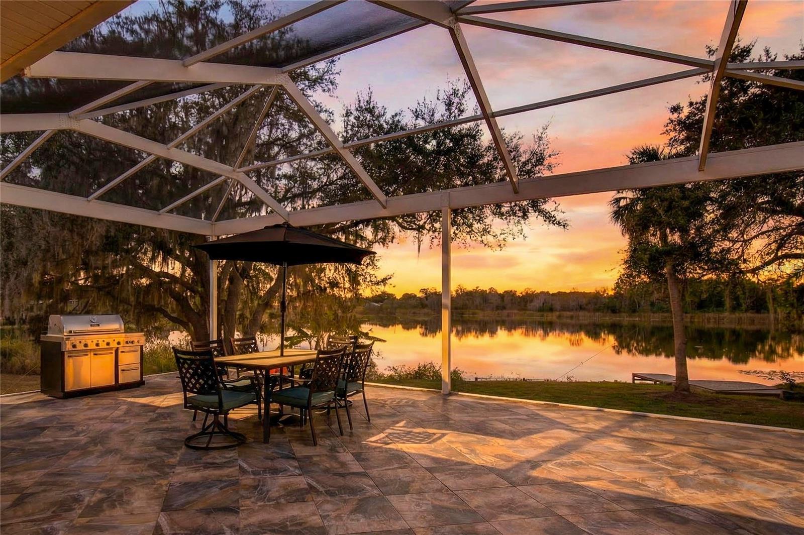 Lakefront Home – 264 S. Central Ave., Umatilla, FL
Discover this exceptional lakefront single-family home in the heart of Umatilla, offering peaceful waterfront living with modern comforts and outstanding energy efficiency. 
Step inside to find a thoughtfully designed, energy-efficient home featuring:

Quartz countertops in the kitchen with all Whirlpool appliances
A large pantry housing a Samsung washer and dryer
Tongue-and-groove cypress ceilings in the living and dining areas
High-grade tile flooring throughout
6" spray foam insulation in the ceiling and around windows for superior efficiency
Custom motorized blinds
Outdoor kitchen setup with gas stub out

The open living space flows beautifully to a wall of high-quality double-pane glass with two 8-foot sliders that open onto a large screened lanai. Enjoy breathtaking lake views, a private dock, and a relaxing hot tub.
Both bedrooms are ensuite with quality glass shower doors (no tubs). The master suite boasts an extra-large walk-in closet and a luxurious dual-head shower. The second bedroom includes a built-in office and a Murphy bed for flexible use.
Premium Features & Upgrades:

Whole-house Generac home generator (regularly serviced under contract)
Trane energy-efficient HVAC system under service contract with St. Louis Air
Whole-house tankless gas water heater (Navien)
All-gas systems: heat, stove, dryer, and water heater
Yard irrigation sourced directly from the lake
Digital entry lock
Extra-large double carport
Outdoor kitchen on the covered porch (with two lakeside entries)
Lockable exterior storage unit in front (houses electric panel and freezer)

Utilities & Infrastructure:

All underground utilities
Sewer lift station that pumps directly to the street sewer

This home is an energy-efficient masterpiece with thoughtful details throughout.
Perfect as a primary residence or a serene waterfront getaway, this lakefront property offers unmatched lifestyle and value in a quiet, scenic setting near the Ocala National Forest.
Don’t miss this rare opportunity — schedule your private showing today!

This sale is subject to a lot split that the City of Umatilla is in favor of, therefore the lot size and square footage of the lot are approximate. The adjacent duplex can also be purchased, if a buyer decided to buy both the lakefront home and duplex a lot split would not be necessary.