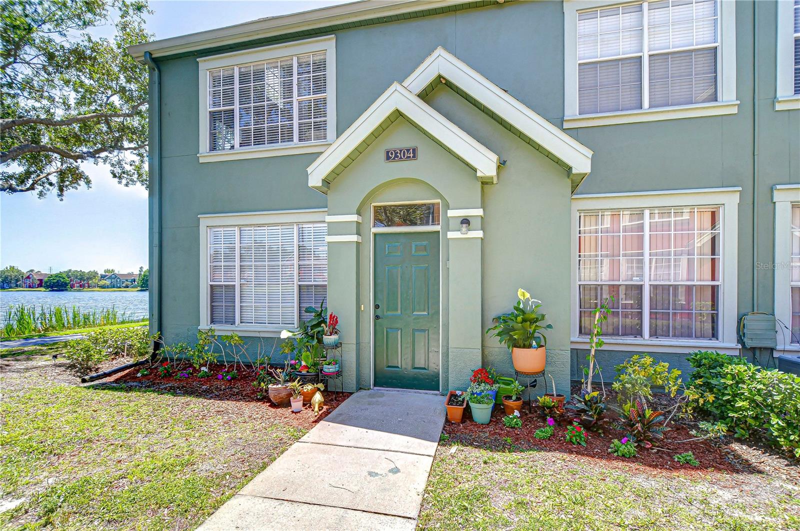 From the moment you arrive, the lush setting and striking lakefront entrance say it all: This Is It.
Step inside to discover a spacious open-concept layout featuring vaulted ceilings, luxury vinyl plank flooring, and an abundance of natural light. The upgraded kitchen is a chef’s delight with stunning marble countertops, remodeled cabinets, and a double oven—perfect for entertaining.

The living area flows effortlessly into the upstairs loft, ideal for a reading nook, office, or playroom. Retreat to the spacious primary suite, complete with a custom barn door, a completely remodeled ensuite bathroom with a walk-in shower, marble countertops, and a walk-in closet offering generous storage.
Bedrooms 2 and 3 are thoughtfully placed on the opposite side of the home for privacy, both offering lake views. Bedroom 3 even features a cozy sitting or office nook. The second bathroom is also fully updated with marble countertop and upgraded cabinetry.
Enjoy the convenience of in-unit laundry, plus your own deeded garage AND carport for parking and additional storage. There is also a large storage closet just inside the front door. 
Delight in cooling off in one of the two beautiful community pools.  Walk along the tranquil lake for some great exercise and meet your neighbors. Or enjoy the basketball, tennis courts or fitness center. This home has it all - close to restaurants and schools. West Chase is centrally located to beaches, Tampa’s amazing sports and nightlife. Your new home awaits. Come fall in Love!