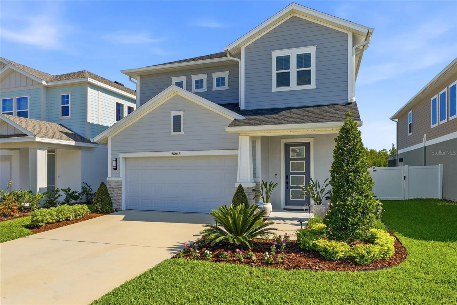 Welcome to 28945 Orange Berry Drive, a beautifully upgraded 4-bedroom, 3.5-bathroom pool home in Wesley Chapel's desirable Persimmon Park community. Built by David Weekley Homes and featuring the sought-after Redwing floor plan, this exceptional residence offers over-the-top upgrades, stunning preserve views, and a level of craftsmanship rarely found in builder-grade new construction.

From the moment you enter, the breathtaking backyard becomes the focal point. Expansive preserve views, lush landscaping, and a sparkling private pool create a resort-style setting that can be enjoyed from nearly every main living space. Large sliding glass doors seamlessly connect the indoors to the outdoor living area, creating the ideal Florida lifestyle for relaxing, entertaining, and everyday living.

The heart of the home is the upgraded kitchen, featuring enhanced cabinetry, upgraded countertops, premium finishes, and an oversized island perfect for gathering with family and friends. The open-concept design flows effortlessly into the dining and living areas, with soaring cathedral ceilings, while showcasing picturesque views of the pool and nature preserve beyond.

The first-floor primary suite serves as a private retreat, offering peaceful backyard views, a spacious en-suite bathroom with dual vanities and walk-in shower, and a large walk-in closet with direct access to the laundry room.

Upstairs, flexible living spaces provide room for everyone. A spacious loft offers endless possibilities as a media room, home office, fitness space, playroom, or second living area. One secondary bedroom features its own private en-suite bath, making it ideal for guests, multigenerational living, or extended stays. Two additional bedrooms and another full bathroom complete the second level.

Unlike many newly built homes, this property already includes the upgrades buyers often spend months and thousands of dollars adding after closing. Every detail has been thoughtfully selected and meticulously maintained, creating a home that feels both stylish and timeless.

Outside, the backyard oasis truly sets this property apart. Enjoy morning coffee overlooking the preserve, afternoons by the pool, and evenings entertaining under the Florida sky with no rear neighbors and beautiful natural views.

Located in the heart of Wesley Chapel, residents enjoy convenient access to Tampa Premium Outlets, The Shops at Wiregrass, AdventHealth, BayCare Hospital, Orlando Health Wiregrass Hospital, Whole Foods, Life Time Fitness, Wiregrass Sports Campus, Cooper's Hawk Winery & Restaurant, and the exciting future Downtown Wesley Chapel development.