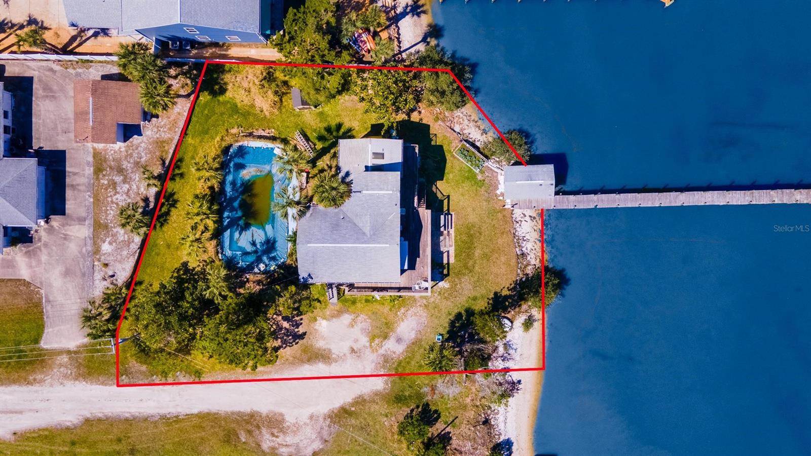 Commercially zoned half acre property with 129’ on the Intracoastal with deep water dock and boat shed offering the ability to redevelop into a boutique hotel, mini-marina or new home with rental units.  The upstairs features 3 bedrooms 2 baths.  The 2 bedroom, 1 bath apartment on the first level was livable until most recent flooding and after repairs from prior flooding.  Large salt pool not in use but had new pump and filter replaced in 2022.  Electric was redone is 2022.   There are 3 electric meters and the zoning is ideal for B&B or income property. Known as the Seven Mile Fish Camp, City of Edgewater Merchant/Retail Business Tax Receipt and Commercial Certificate of Use are both up to date.  B-4 Tourist Commercial Zoning is intended for short term waterfront accommodations and includes residential mixed-use. Permitted uses include Bed and Breakfast, Hotel/Motel, Marina and more. ;Water: City