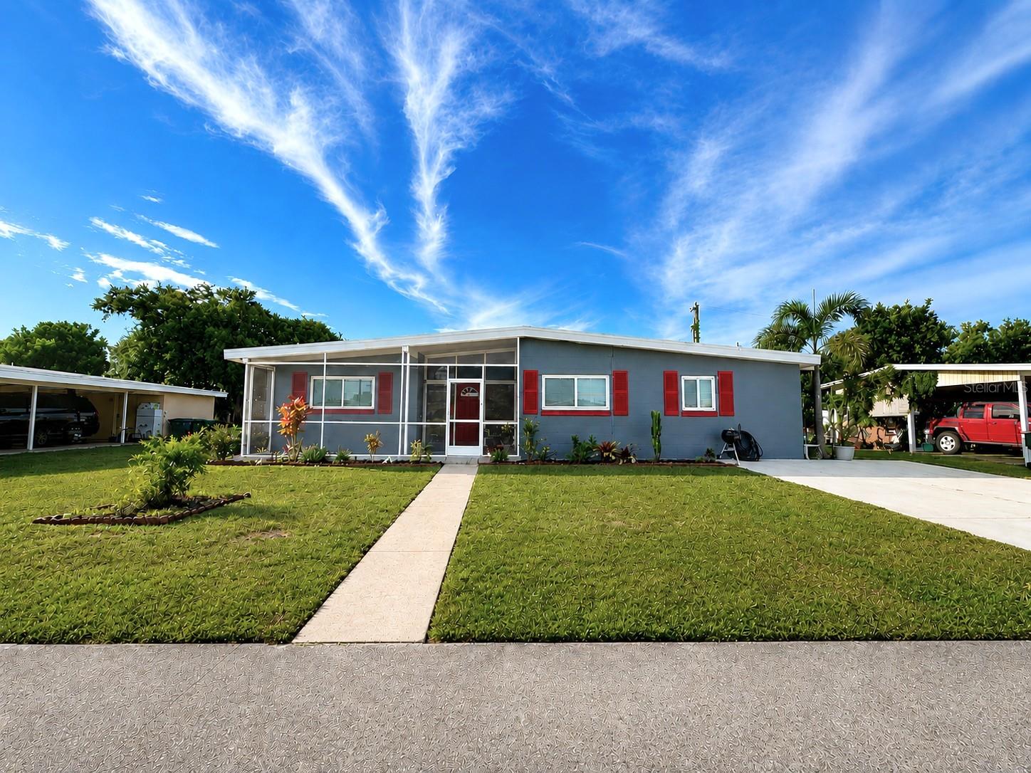 Step into the perfect blend of classic Florida charm and modern-day comfort in this beautifully updated 3-bedroom, 1-bathroom concrete-block home. Built in 1961 and thoughtfully renovated throughout, this move-in-ready residence offers nearly 1,100 square feet of comfortable living space on a spacious 0.17-acre lot—with no HOA and no deed restrictions, giving you the freedom to truly make it your own. From the moment you enter, you'll appreciate the bright, open-concept layout, enhanced by tile flooring throughout for easy maintenance and timeless appeal. The spacious living room flows seamlessly into the dining area and then to the kitchen, creating the ideal space for everyday living and effortless entertaining. The modern kitchen combines style and functionality, featuring updated appliances, closet pantry, abundant cabinetry, and generous counter space for meal preparation, gatherings, and daily convenience. Natural light pours into the primary bedroom through a wall of rear-facing windows overlooking the private fenced backyard, creating a peaceful retreat. A private exterior door from the primary bedroom leads to a covered, screened-in breezeway and then into the laundry room, adding both charm and practicality. Two additional guest bedrooms offer comfortable accommodations with built-in closets and ceiling fans, while the centrally located bathroom has been beautifully renovated with a new vanity, tub, toilet, shower door, and stylish wall tile. Major improvements provide exceptional value and peace of mind, including a roof, hot water heater and complete electrical rewire completed just three years ago. Additional upgrades include wide baseboards, new interior and exterior doors, updated lighting and fixtures, new flooring, hurricane shutters, new hose bibs, and a widened driveway.  Step through the sliding glass doors into a spacious screened-in lanai, featuring epoxy flooring and a ceiling fan. The fully fenced backyard truly offers endless possibilities!! Whether you envision a lush garden, expanded patio, outdoor entertaining space, or future pool, there's plenty of room to bring your ideas to life. The home's solid concrete-block construction and slab foundation further enhance its durability and long-term appeal. Conveniently located just minutes from US-41 and I-75, you'll enjoy quick access to shopping, dining, parks, medical facilities, top-rated schools, and all the attractions Southwest Florida has to offer. Whether you're a first-time homebuyer, seasonal resident, investor, or someone looking to downsize without sacrificing comfort or quality, this beautifully maintained home presents an exceptional opportunity.  Don't miss your chance to own a move-in-ready Florida gem with modern updates, lasting value, and room to grow.