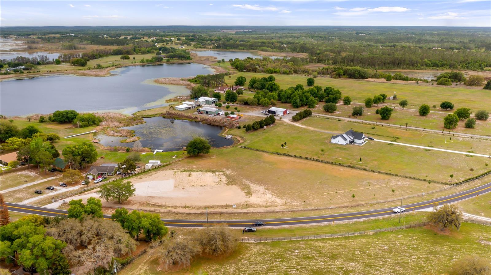 Enjoy the freedom of country living on this beautiful 5-acre lakefront property in Clermont.  Bring your livestock, equipment, and recreational toys with plenty of space to spread out and no HOA restrictions. The property is conveniently located off CR 561 on Lake Gary, perfect for fishing and outdoor enjoyment. Building pad and some site work have been done, including 12" deep gravel driveway. Ideally situated in a peaceful rural setting while still just a short drive to town for shopping, dining, and everyday conveniences.