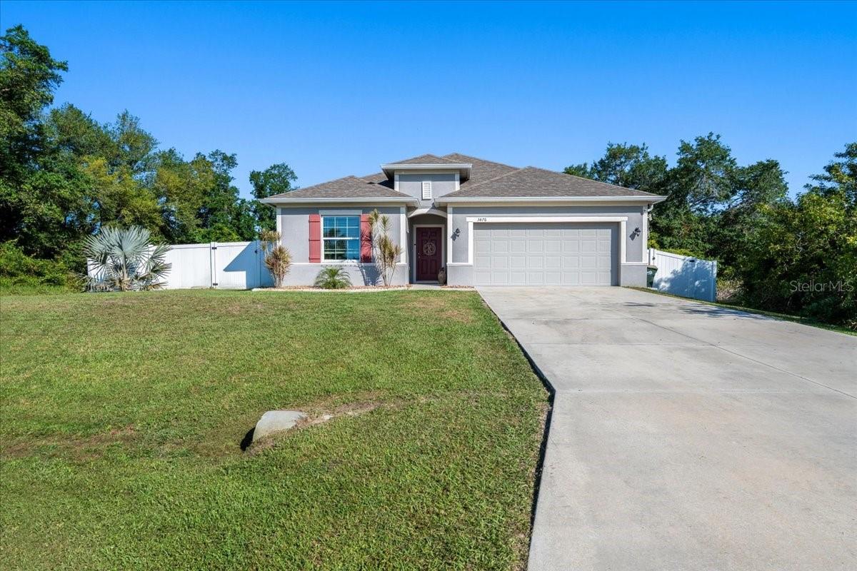Welcome home to this beautifully maintained 4 bedroom, 2 bathroom retreat in the heart of North Port, where comfort, space, and everyday convenience come together effortlessly. Offering 2,141 square feet of bright, thoughtfully designed living space, this home invites you in from the moment you arrive with its charming curb appeal, extended driveway, and spacious 2-car garage.

Step inside and immediately feel at home in the light-filled open floor plan, designed for both everyday living and entertaining. Modern light fixtures and ceiling fans add stylish touches throughout, while the warm, welcoming atmosphere makes every space feel inviting. At the heart of the home, the beautifully appointed eat-in kitchen features a large island, abundant counter space, and updated finishes, creating the perfect gathering place for morning coffee, family dinners, and celebrations with friends.

The primary suite offers a peaceful escape at the end of the day, complete with dual vanities, a relaxing soaking tub, and a spacious walk-in shower. Generously sized guest bedrooms provide comfort and flexibility for family and visitors alike, while the additional flex space is ready to become whatever you need it to be a home office, playroom, hobby room, or study area.

Outside, you'll find a fully fenced backyard designed for enjoying Florida living year round. Whether you're hosting weekend barbecues, watching pets play, tending to a garden, or simply unwinding under the evening sky, this outdoor space is ready for countless memories to be made.

Ideally located just minutes from highly rated schools, popular local restaurants, shopping, and the beloved North Port Aquatic Center—with its lazy river, water slides, and resort style pool. This home offers the perfect blend of tranquility and convenience.

If you've been searching for a place that feels like home the moment you walk through the door, this North Port gem is one you won't want to miss. Come experience the warmth, comfort, and lifestyle waiting for you here