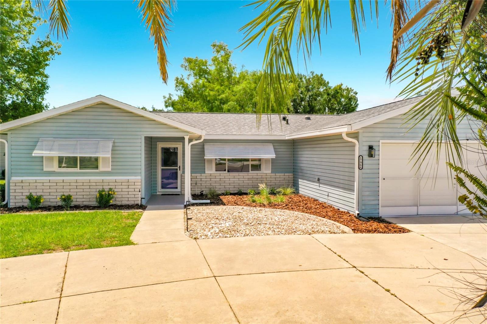 Welcome to your dream home—Fully Updated, Completely Move-In Ready, and situated on a Highly Desirable Corner Lot in the sought-after Gated Community of Spruce Creek South!

From the moment you arrive, you'll be captivated by the exceptional curb appeal, beautifully maintained landscaping, and the convenience of a rare double-access driveway. Step inside and discover a home that has been thoughtfully renovated from top to bottom, offering the perfect blend of comfort, style, and functionality.

As you enter, the welcoming foyer opens to an expansive, light-filled floor plan where the formal dining area, spacious family room, and beautifully updated kitchen seamlessly come together. Professionally staged and designed for effortless living, this home is truly move-in ready and waiting for its next owner.

The open-concept layout is ideal for entertaining or everyday living, allowing you to stay connected with family and guests while preparing meals. Gather around the breakfast bar, share conversations, and create lasting memories in a space designed for both comfort and functionality.

The stunning kitchen is a chef's delight, featuring beautiful new countertops, an eye-catching designer backsplash, a deep sink, abundant cabinetry, and all the appliances you'll need to bring your culinary creations to life.

Throughout the home, you'll find spacious rooms enhanced by new luxury vinyl plank flooring, fresh interior paint, and stylish modern fixtures that create a warm, inviting atmosphere.

Retreat to your private primary suite, where comfort meets luxury. The beautifully renovated en-suite bathroom showcases a breathtaking designer walk-in shower, creating a spa-like retreat you'll enjoy every day.

Step outside to one of the home's most inviting features—your fully enclosed, air-conditioned lanai. Surrounded by windows that fill the space with natural light and complemented by the shade of an awning, this versatile retreat is the perfect place to enjoy your morning coffee, savor breakfast, entertain friends, or unwind in the evening with a glass of wine and a good book.

About Spruce Creek South

Spruce Creek South is a vibrant, gated 55+ golf community of approximately 1,600 homes, celebrated for its peaceful atmosphere, oversized homesites, and outstanding amenities—all without the congestion of larger neighboring communities.

Residents enjoy:

18-hole championship golf course with pro shop
On-site restaurant featuring live entertainment
Softball fields
Dog park
RV and boat storage
Air gun club
Miles of scenic walking and biking trails

One of the community's most desirable features is the private residents-only golf cart gate providing direct access to Terrace Plaza, where you'll find restaurants, grocery stores, pharmacies, medical offices, dentists, salons, and other everyday conveniences just a short golf cart ride away.

Whether you're looking for an active retirement filled with recreation and social events or a peaceful place to relax and call home, this exceptional property offers the very best of Florida living.

Don't miss your opportunity to own this beautifully updated home in one of Central Florida's most desirable active adult communities. Schedule your private showing today and start living the retirement lifestyle you've always dreamed of. Welcome to Spruce Creek South. Welcome Home.