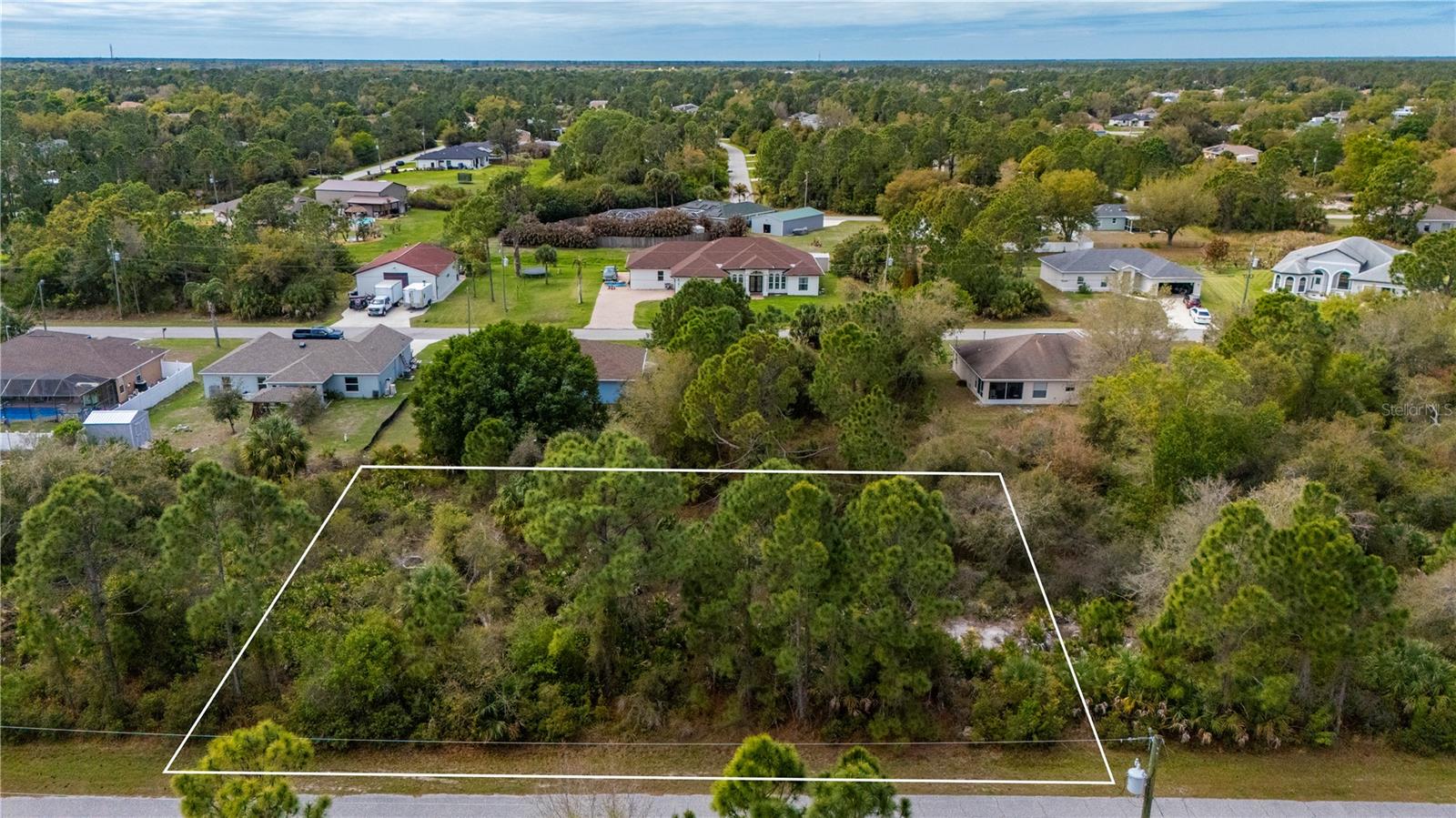Two incredible lots combined into nearly half an acre of opportunity await! Whether you're dreaming of building your custom home, developing an investment property, or simply securing a slice of Florida's beauty, this spacious vacant land offers endless potential. With ample room to bring your vision to life and nestled in a location that's both serene and convenient, it's the perfect canvas for your next project. Don’t miss this rare chance to own such a generous parcel.