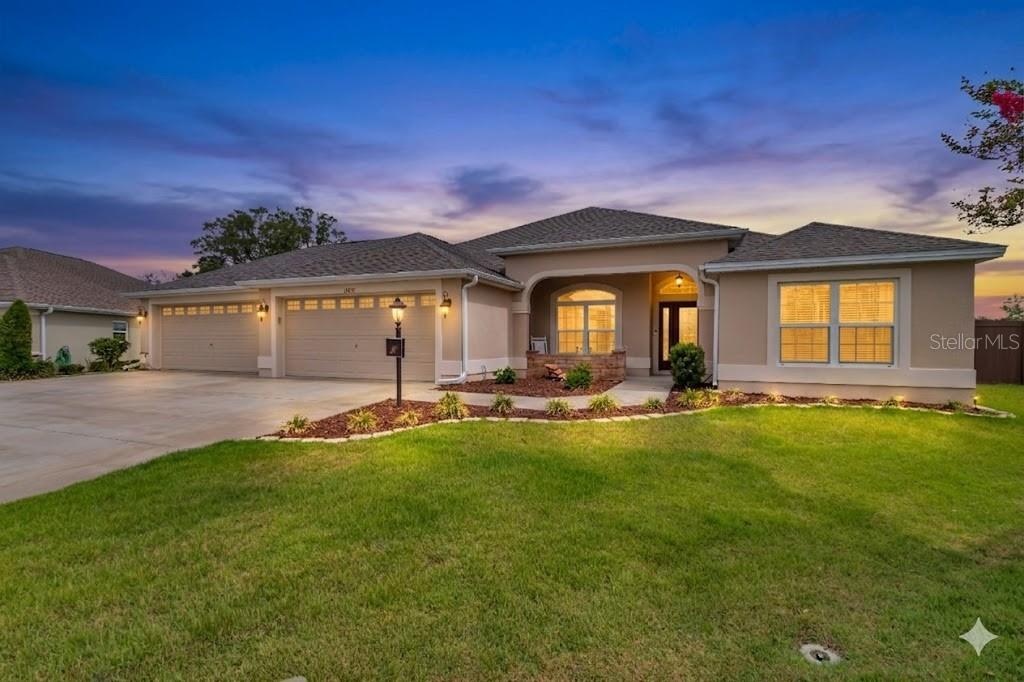 Virtually Staged. Welcome to modern elegance in the highly sought-after community of Oxford Oaks. This stunning 2017-built estate perfectly balances sophisticated style with everyday functionality, offering 4 spacious bedrooms, 3 full bathrooms, and 2,270 sq. ft. of bright, open-concept living space. Situated on an impressive, oversized 0.39-acre lot, this property provides a rare level of outdoor freedom and privacy. The heart of the home features a beautiful gourmet kitchen with sleek countertops and a large central island that effortlessly overlooks the expansive living and dining areas. Step through the sliding glass doors to your spacious screened lanai—the ultimate spot for morning coffee, evening relaxation, and seamless indoor-outdoor Florida living. Beyond the lanai, a massive backyard canvas awaits, perfect for pets, play, or creating your dream pool oasis. Retreat to the private owner’s suite, featuring a walk-in closet and a spa-inspired bath. Residents of this gated enclave enjoy premier amenities including a resort-style pool, pickleball and tennis courts, a playground, and golf-cart-friendly paths. Located just minutes from The Villages, top-rated charter schools, fine dining, and endless shopping, this exceptional property offers the ultimate Central Florida lifestyle. Schedule your private tour today!