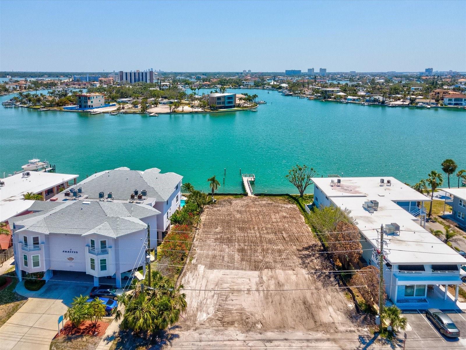 This exceptional waterfront lot in the heart of Treasure Island offers a rare blend of lifestyle, location, and investment potential. Zoned for multifamily residential use with the ability to build up to five units with current zoning, it’s the perfect canvas for a luxury townhome project, boutique rental property, or high-end vacation retreat. Situated on a peaceful canal with direct boating access and no fixed bridges to the Gulf, this lot provides stunning water views and a true boater’s paradise. Not to mention it is just a short walk from some of Florida’s finest sugar-sand beaches—ranked among the best in the United States—you’ll also find an array of popular restaurants, beach bars, and shops just steps from your future doorstep. Whether for full-time residents or vacationers, this area offers a walkable, coastal lifestyle that’s hard to match. Convenience is another major draw. The property is just 30 minutes from Tampa International Airport and only 15 minutes from downtown St. Petersburg, where you’ll find professional sports, vibrant nightlife, art galleries, and a dynamic culinary scene. With its unmatched location, flexible zoning, and strong demand for coastal living, this Treasure Island lot presents an outstanding opportunity for developers or visionary buyers to create something truly special. Opportunities like this don’t come around often—schedule a visit today and start planning your next great project on Florida’s Gulf Coast.