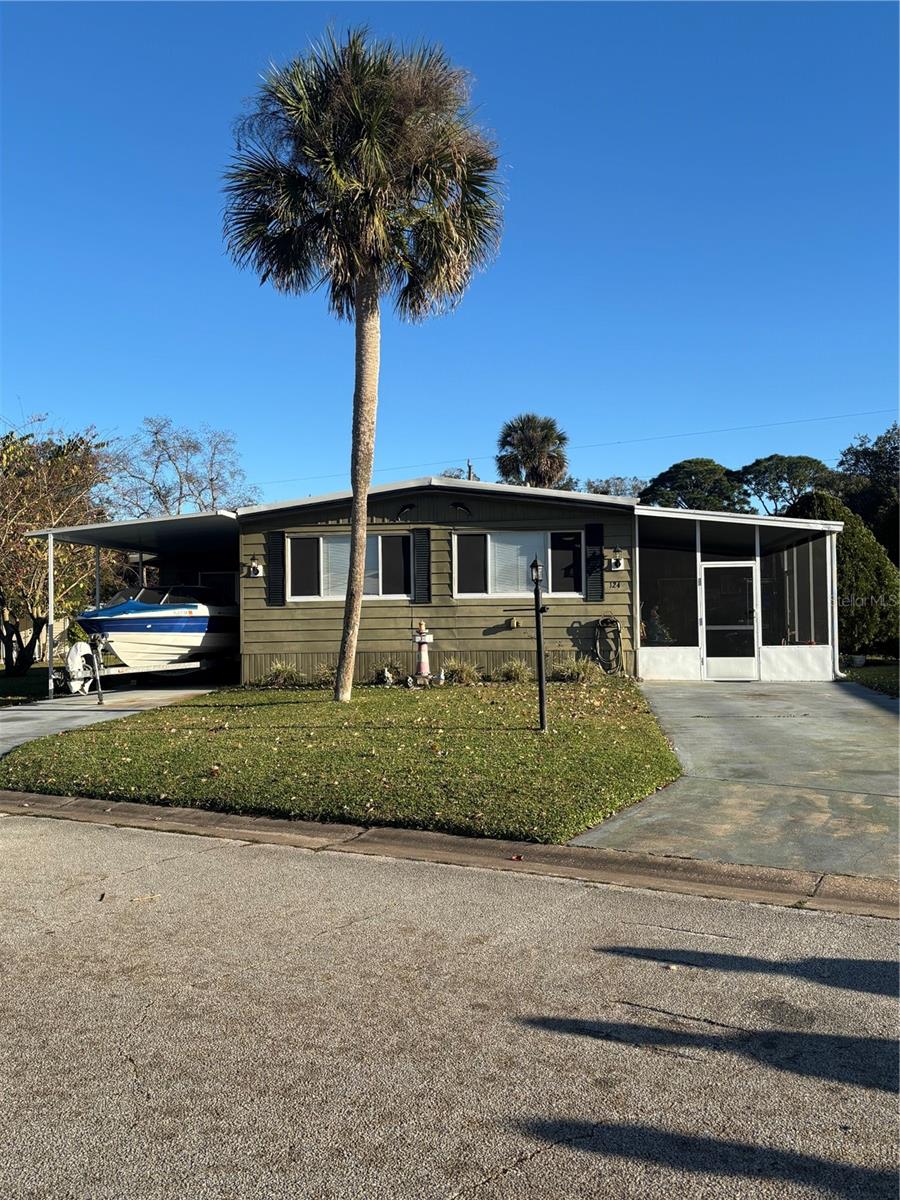 Discover this absolutely charming, move-in ready 2-bedroom, 2-bath mobile home tucked away in the highly sought-after riverfront community of Terra Mar Village. This 2-bedroom, 2-bathroom property offers a comfortable and functional layout with spacious living and dining areas. The highlight of the home is the large enclosed sun-in room—perfect for relaxing, entertaining, or enjoying Florida’s beautiful weather bug-free year-round. The kitchen features ample cabinet space and flows seamlessly into the main living areas. Both bedrooms are generously sized, and the primary suite includes an en-suite bath for added privacy. Outside, enjoy a nicely oversized yard with plenty of room for gardening or outdoor activities. 
Located in the tranquil community of Terra Mar Village, this neighborhood features two 40,000-gallon saline swimming pools, one of which is heated year-round, and a private 300-foot fishing pier along the scenic Florida Intracoastal Waterway. Outdoor enthusiasts will appreciate the shuffleboard, bocce ball, and horseshoe courts, while the large brick clubhouse is perfect for social gatherings and community events held throughout the year. Boating enthusiasts will love the newly constructed secure marina with covered boat lifts and slips, offering easy access to the Intracoastal Waterway (slip leases are currently available). A convenient community boat launch makes it easy to start your water adventures. Additionally, affordable on-site RV and trailer storage is available for a minimal monthly fee. Terra Mar Village provides a perfect balance of recreation, relaxation, and community, making it ideal for families or anyone seeking a peaceful yet active lifestyle.
