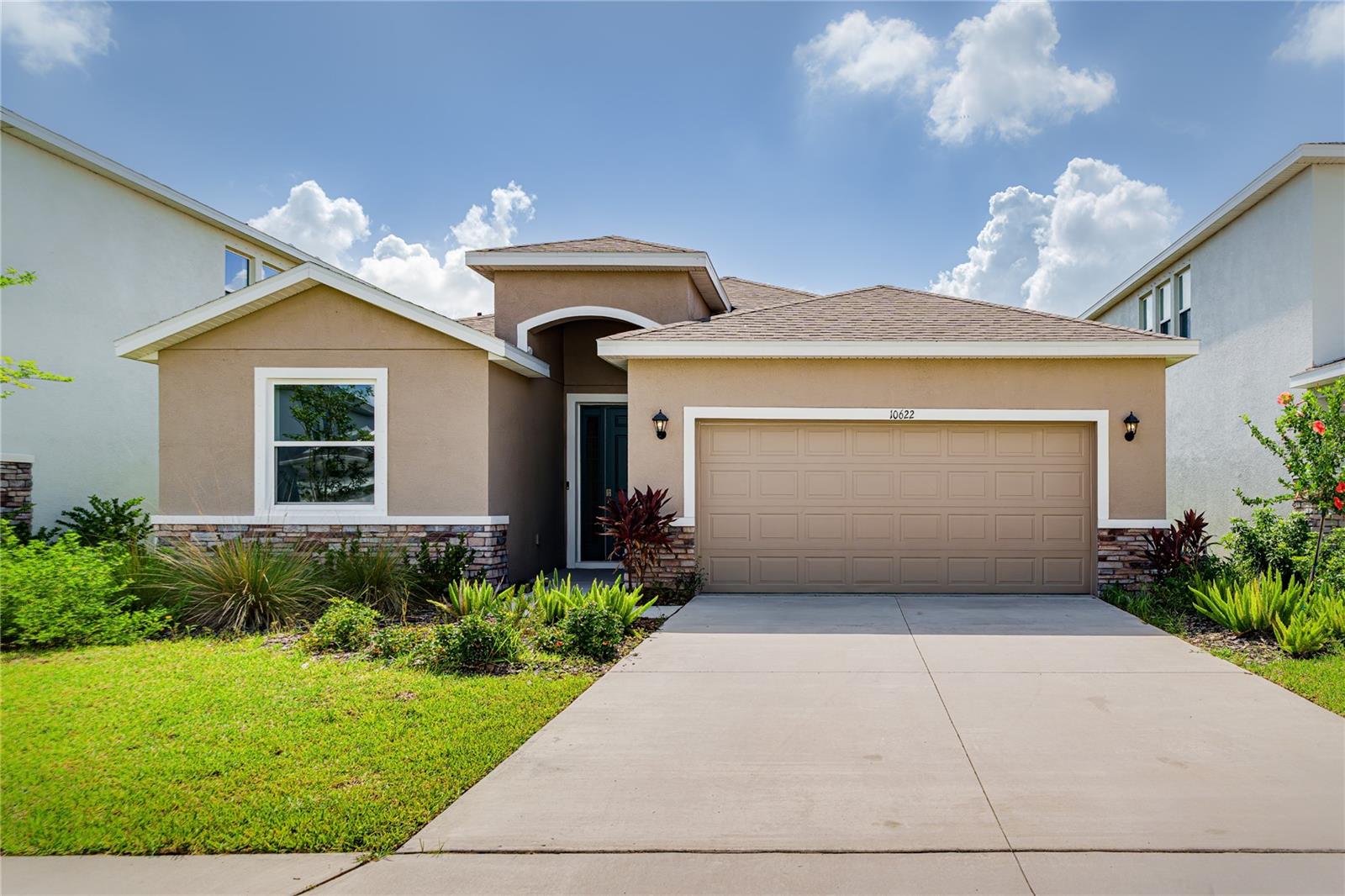 Perfectly positioned on a premium preserve lot with no rear neighbors, this better-than-new 4-bedroom, 2.5-bath all-concrete block home, built in 2024, offers the ideal combination of privacy, modern design, and everyday convenience in the sought-after Bella Lago community. This move-in-ready home features a bright open-concept floor plan filled with natural light, upgraded luxury vinyl plank flooring, and stylish modern finishes throughout. The spacious kitchen is the heart of the home, showcasing all-white cabinetry, quartz countertops, stainless steel appliances, and a sleek white glass Samsung Bespoke refrigerator, all flowing seamlessly into the living and dining areas for easy entertaining. The spacious primary suite offers a private retreat with his-and-hers walk-in closets and a luxurious ensuite bathroom complete with dual sinks, an oversized vanity, garden tub, separate shower, and private water closet. Three additional bedrooms and a flexible fourth bedroom with a half bath provide plenty of space for guests, a nursery, home office, or bonus room. Step outside through sliding glass doors to the screened lanai and enjoy peaceful preserve views with nature as your backyard. Additional features include smart home technology, security system, two-car garage, and Flood Zone X for added peace of mind. Bella Lago offers resort-style amenities including two community pools, clubhouse, fitness center, playground, and dog park. Conveniently located near I-75, I-275, and US-301, with easy access to Bradenton, Sarasota, St. Pete, Tampa, and the Gulf beaches. Plus, the rapidly growing Moccasin Wallow corridor nearby continues to add value with BayCare Hospital, Seaire Lagoon, shopping, dining, and everyday conveniences just minutes away. This is your opportunity to own one of Bella Lago’s best values with premium privacy, newer construction, and an unbeatable location.