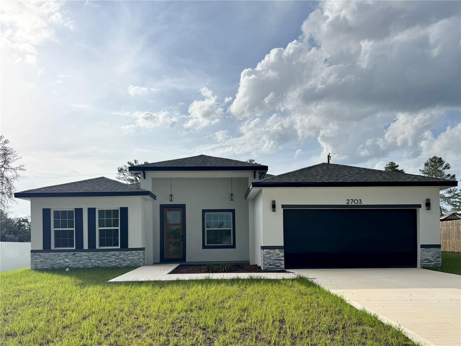 **NEW CONSTRUCTION** MOVE IN READY | No HOA | No CDD | DUAL SUITE Layout **Exclusive Floor Plan** Brand-New Luxury Residence 4-bedroom, 3-bath home with lots of upgrades - modern, spacious, and designed for families seeking comfort, privacy, and convenience. Builder did not scale back with design options :::HIGHLIGHTS::: DUAL Suite Layout for in-laws, guests, or multigenerational living featuring a Primary Suite with His & hers Walk-in closets and a Secondary Suite with a private bath & walk-in closet | Quartz countertops on kitchen and bathrooms | High Ceiling and Open Concept featuring integrated living, dining, and kitchen | Luxury Vinyl flooring throughout | Stainless Steel Appliances included: microwave, dishwasher, disposal, electric water heater, refrigerator & range | **Zoned for the NEW HIGH SCHOOL (open Aug/2026)** :::: Step inside to a bright, airy layout with a spacious open-concept design perfect for family gatherings. The kitchen stands out with quartz countertops and premium stainless steel appliances, making the home truly move-in ready. Oversized 2-car garage (20x20) with Painted Floor. Located in the fast-growing Marion Oaks community, close to supermarkets and with quick access to I-75, making daily routines convenient and straightforward. A rare combination of modern design, family-focused functionality, and everyday convenience in one of Ocala’s fastest-growing communities.