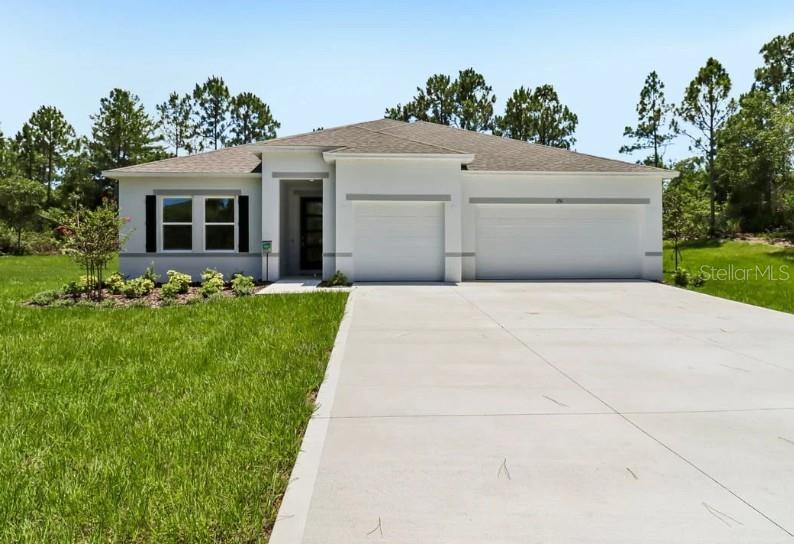 Ready Now!! Claim your piece of paradise!  An exceptionally oversized homesite sets the stage for endless possibilities, with ample room for a boat, RV, and more, all while enjoying the coastal charm of Edgewater. Known as the locals’ choice for East Coast beaches, this waterfront community rests along the tranquil Indian River in Florida and is celebrated for its relaxed atmosphere, scenic parks, nature trails, and proximity to some of the region’s most beautiful shorelines. Local boutiques, waterfront dining, and year-round community events create a vibrant setting surrounded by natural beauty.

The Wilmington plan showcases impressive design and thoughtful upgrades throughout. A striking 8 foot front door opens to soaring 9 foot 4 inch ceilings, enhanced by deluxe trim and cordless blinds that elevate every space. The great room flows effortlessly into a gourmet kitchen featuring the builder’s upgraded configuration with wall oven and cooktop, abundant cabinetry, and generous workspace designed for both everyday living and memorable gatherings.

Privacy and comfort are beautifully balanced with a split bedroom layout. The primary suite becomes a peaceful retreat with upgraded cabinetry, enhanced countertops, dual split vanities, and an oversized tile shower as part of the deluxe bath option. On the opposite side of the home, two additional bedrooms are thoughtfully positioned alongside a full bath and a convenient linen closet, creating a well organized and functional private wing. The fourth bedroom features its own private bath, adding another level of comfort and flexibility.

Outdoor living is just as impressive, beginning with the welcoming covered front porch and continuing to the oversized screened patio that extends the living space into the outdoors. Hurricane shutters provide added peace of mind, while professional landscaping and irrigation complete the exterior with lasting beauty.

An oversized three car garage delivers outstanding space for storage, hobbies, and vehicles. Every detail of this Wilmington plan reflects quality construction, elevated finishes, and the added confidence of a full builder warranty, all set within one of the most desirable coastal locations on Florida’s East Coast.