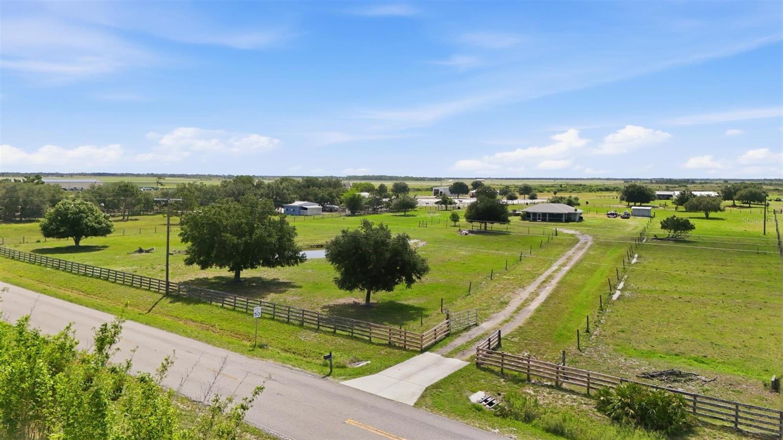 Rare opportunity to own a private 6.2-acre agricultural zoned property offering a blend of country living and modern comfort. Bring your horses, donkeys, cows, chickens and all the animals you’ve dreamed of. This fully fenced property is ready for your farm, homestead or family compound. The beautifully updated home features a functional split bedroom floor plan and an open-concept kitchen and has been meticulously maintained. Major updates include a new roof (2025) and a new air-conditioning system (2025), providing peace of mind for years to come. Properties like this are becoming increasingly difficult to find in this desirable area. Enjoy the tranquility and privacy of rural living while benefiting from exciting future growth nearby, including planned golf courses and an equestrian center just down the road. Whether you’re looking for room to roam, space for animals or a peaceful retreat for the entire family, this exceptional property offers endless possibilities. Move right in and start enjoying the lifestyle you’ve always wanted.