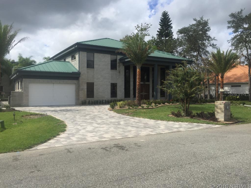 Top of the line custom home with European contemporary twist and large 85'x70' hangar. Located on a double lot, main house, separate guest house, separate hangar apartment, spacious pool area &jacuzzi. One of the largest non-commercial hangars of Spruce Creek. All building materials, such as split face block, metal roof and steel re-enforced beams make this home extremely strong and energy efficient. The Atrium style great room features 19' ceilings, stone fireplace, 9'' Canadian birch flooring, intricate halogen lighting system and entertainment alcove with acoustic panels. Modern kitchen with huge island, custom designed Leicht cabinets and countertops made from exotic Brazilian granite. Glass top stove. ;Water: City