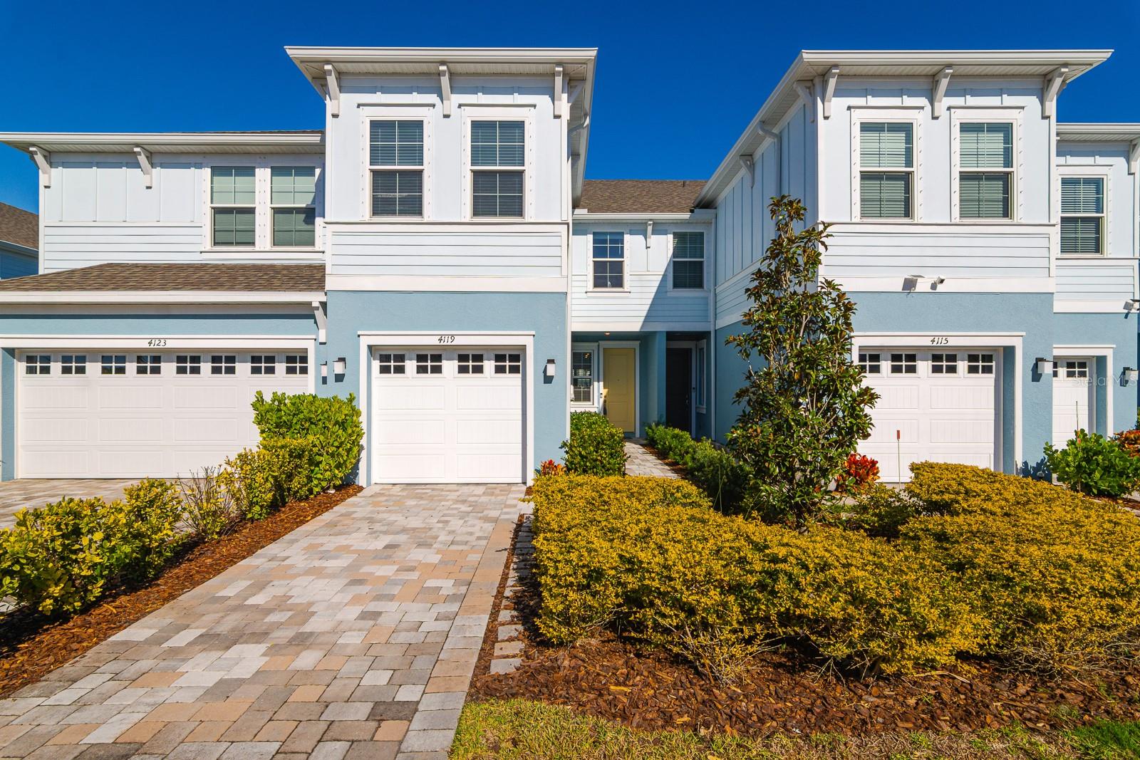 STUNNING TOWNHOME WITH EXPANSIVE POND VIEWS! This impeccably maintained 3-bedroom, 2.5-bath townhome offers approximately 1,920 square feet of thoughtfully designed living space, complete with a one-car garage and serene water views that create a truly peaceful setting.

Upon entering, you are welcomed into a spacious and open great room with plenty of room for both living and dining—perfect for everyday comfort and entertaining alike. The stylish kitchen features quartz countertops, stainless steel appliances, abundant cabinetry, and bar seating, making it both functional and inviting. A convenient pantry provides additional storage, while the open layout allows natural light to flow throughout the space. The entire first floor is finished with elegant wood-look ceramic tile, adding warmth and durability.

Upstairs, upgraded wood flooring continues through the stairway and hallway, leading to a well-designed split bedroom layout. The spacious owner’s suite overlooks the tranquil pond and features a large walk-in closet and an oversized en-suite bathroom with dual sinks. Two additional bedrooms are nicely sized and finished with plush carpeting, offering flexibility for family, guests, or a home office. The upstairs laundry room adds everyday convenience and ease.

Step out onto the lanai and relax while enjoying peaceful pond views and abundant wildlife, creating a private and serene outdoor retreat. This home is move-in ready, very well maintained, and offers modern finishes throughout. Ideally located near shopping, dining, and everyday conveniences, this townhome combines low-maintenance living with comfort, style, and beautiful water views—an exceptional opportunity you won’t want to miss.