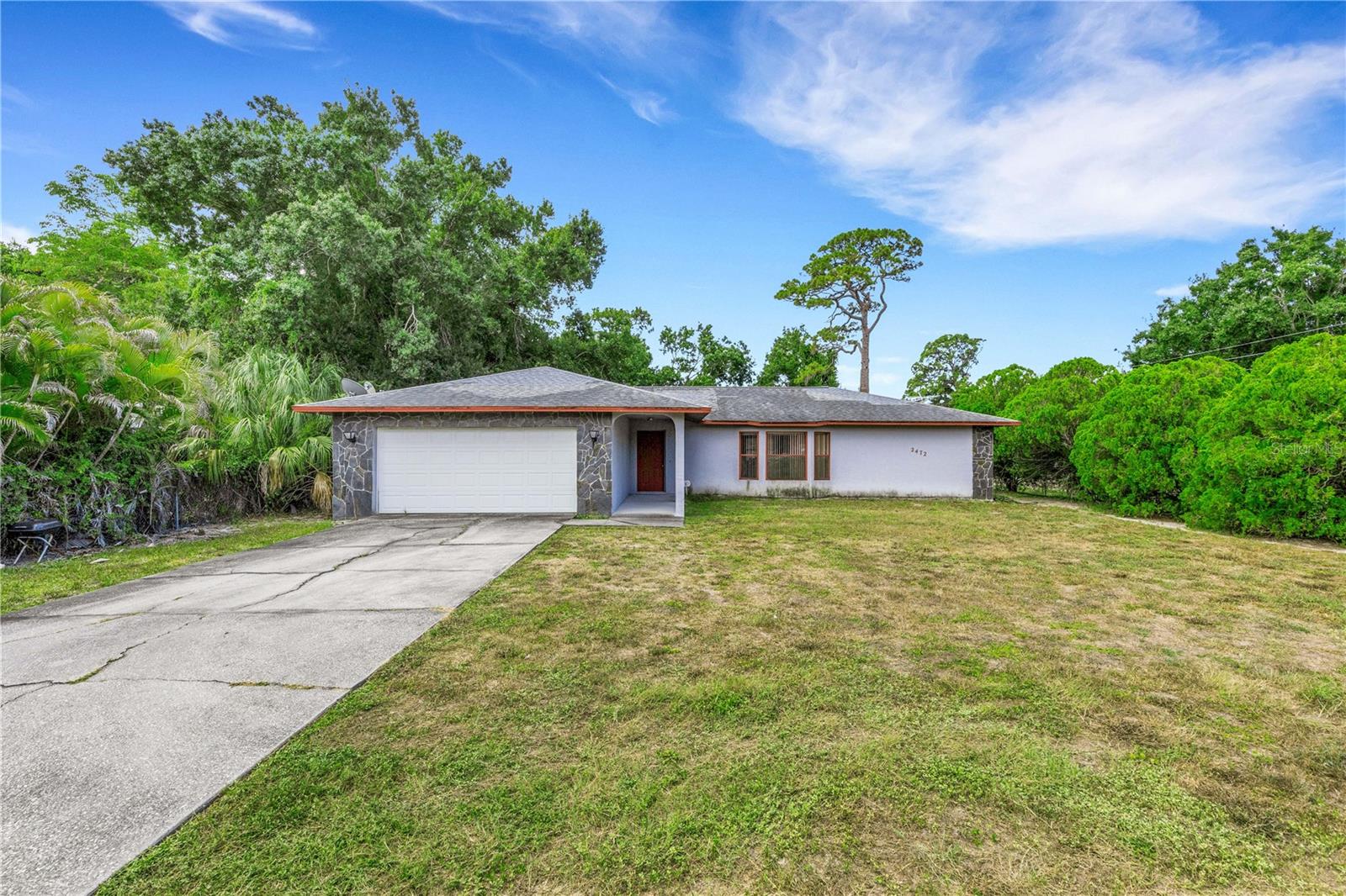 Located on a generous corner homesite spanning approximately 22,000 square feet (just over half an acre), this property offers a rare opportunity to own a homesite of this size in an established Sarasota neighborhood with no HOA restrictions.
The existing three-bedroom, three-bath split-bedroom home features nearly 1,900 square feet of living space, multiple gathering areas including both a living room and family room, an eat-in kitchen with breakfast bar, a two-car garage, and a covered rear patio overlooking the expansive fenced backyard.
Whether you're looking to renovate, restore, or personalize, the true value lies in the combination of the generous homesite, functional floor plan, and convenient Sarasota location. The expansive yard provides outdoor space and flexibility that is increasingly difficult to find in this area.
Property is being sold As-Is and presents an exceptional opportunity to create something uniquely your own.
