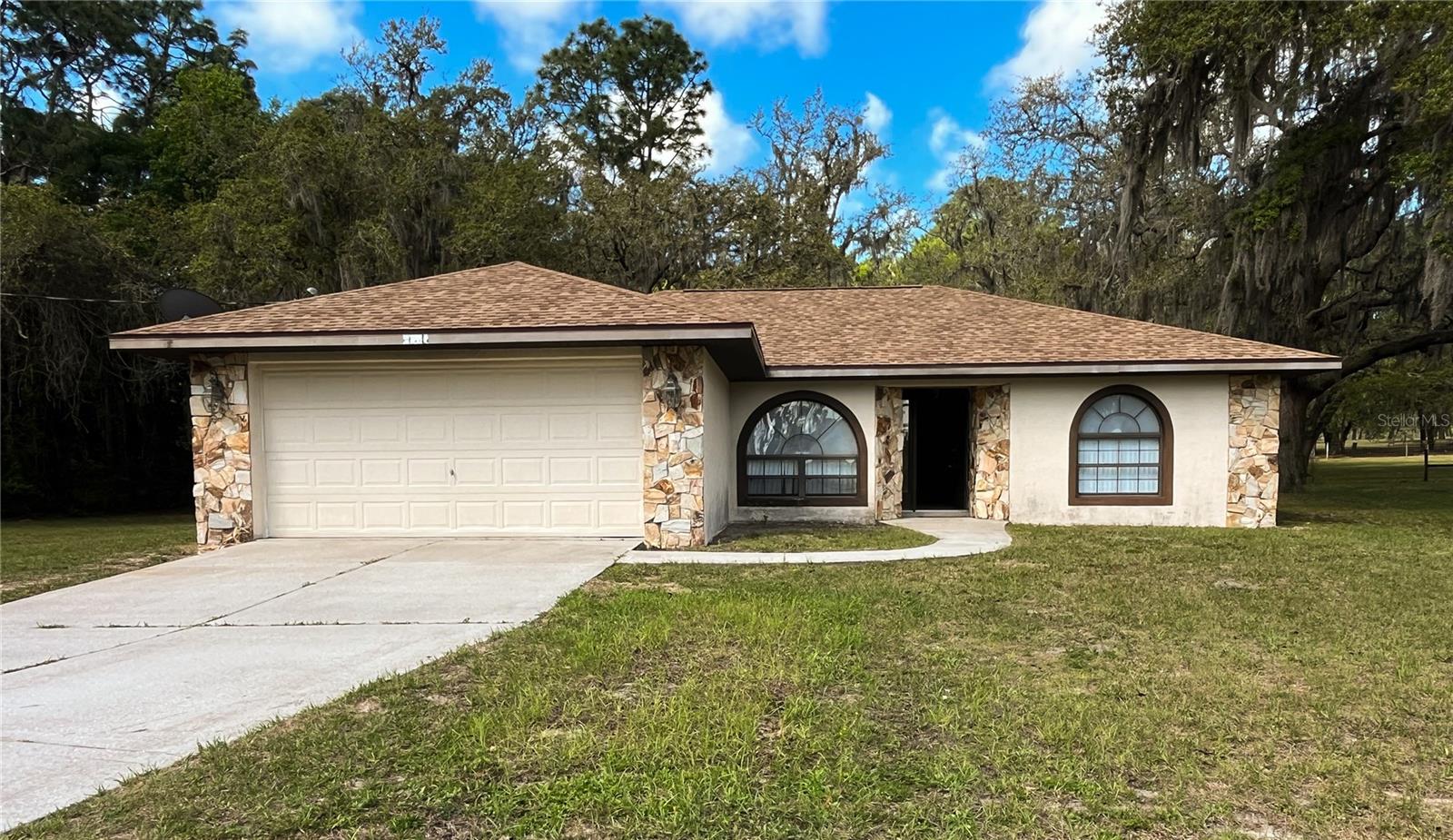 Rare opportunity: Located just a mile from the beautiful Withlacoochee River, this 2.85 acres in Bushnell has a solid 3-bed, 2-bath concrete block stucco home. Built in 2003 by
local builder L. Norman Adams, this 1,371 sq ft residence includes a two car garage and sits on a peaceful,
private parcel zoned RR1 with the potential to split out a 1 acre homesite (verify specifics with Sumter County). No HOA or
restrictions. 
Imagine country living under mature oak trees with cleared pastureland ideal for multigenerational living, a
workshop or barn, room for an RV/boat, gardening, or raising chickens. With a few updates this home can
become a nature lover's dream or a strong investment with future development potential.

Convenient to Bushnell, Brooksville, Spring Hill, Inverness and Tampa, with I75 just down the road.  The property is quiet, country living at it's best. There is a Dollar General less than a mile from the property.  Nature coast beaches are just a 40 minute drive.  Properties combining land, a
sturdy home, and future flexibility are rare! Don't miss this one. Contact your agent to schedule a showing.