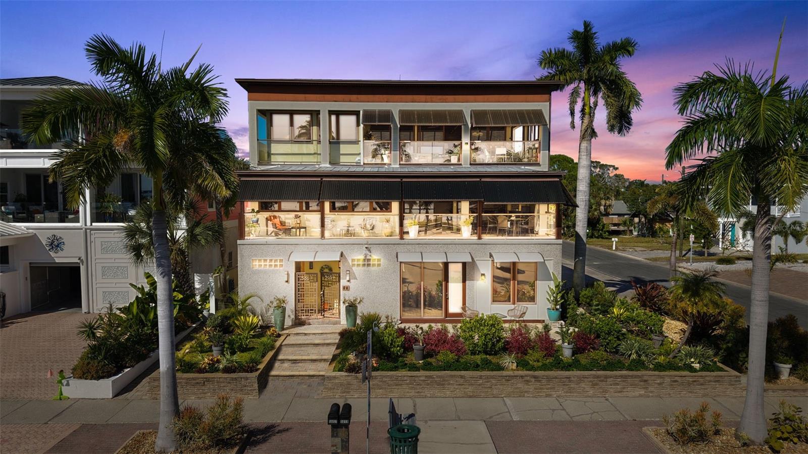Under contract-accepting backup offers. Discover a one-of-a-kind modular home steps from
Boca Ciega bay with fabulous views from every level. This stunning home boasts 7 bedrooms, 7.5 bathrooms, and a spacious 5-car garage. Imagine the options afforded by this layout. Perfect for multi generational living, Airbnb or income producing potential,1031 exchange, Entrepreneurial think tank retreat,hotel or one large single dwelling. Featured RV garage, perfect for storing your work vehicle, creating a mobile office or even launching a rental business.

Step into your own private retreat, featuring separate living quarters on each level. With private entrances and upscale finishes throughout, you’ll enjoy flexibility without sacrificing privacy.

The top floor is a true sanctuary—your personal haven with 3 bedrooms, a beautifully designed office, and breathtaking views of Boca Ciega Bay. Bask in natural light on rich mahogany floors beneath soaring vaulted ceilings. The gourmet kitchen, equipped with a gas stove and expansive island, leads to a covered veranda where sunsets paint the sky, perfect for entertaining or evenings of relaxation.

The second floor is a versatile space, currently optimized as a 2-bedroom suite and 1-bedroom executive apartment—ideal for guests or rental income.

On the ground floor, a charming studio suite offers an additional escape, complemented by a well-equipped workshop and beautiful landscaping nourished by a well-water irrigation system.

Every inch of this estate reflects unparalleled craftsmanship with features like hurricane-impact windows, individual climate control for each space, tankless water heaters, and a whole-house water filtration system.

Designed to embrace the luxury of coastal living while providing peace of mind with CAT 5 storm resilience.

This home truly stimulates everyone’s imagination. Embrace the ultimate Florida lifestyle—this exceptional property awaits your personal touch! In the heart of downtown Gulfport steps from Boca Ciega Bay.