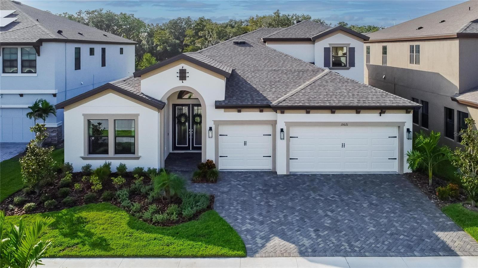 BUYER INCENTIVE! $10k toward rate buy down or buyer closing costs with accepted offer! Welcome to your dream home! This stunning 4-bedroom, 4-bathroom upgraded home is a true masterpiece, offering a luxurious and comfortable living experience. With over 3,000 square feet of living space, high ceilings, 8 foot doors, additional office, a bonus room upgraded baseboards and so much more! This home has been meticulously designed and enhanced with over $100,000 in upgrades, ensuring a lifestyle of both elegance and functionality.  

As you step inside, you'll immediately notice the exquisite tile flooring that extends throughout the main living areas, creating a sleek and cohesive look. The open-concept floor plan flows seamlessly from room to room, making it perfect for both entertaining and everyday living.
The heart of this home is the master suite, conveniently located on the main level for added privacy and convenience. It boasts ample space, large windows that flood the room with natural light and beautiful views of the conservation, and a luxurious ensuite bathroom featuring top-of-the-line fixtures, a walk-in shower, and dual sinks and large closets. This is your own private retreat.

The spacious living area is perfect for hosting gatherings, with a breathtaking view of the conservation area and pond right from your living room.  The gourmet kitchen is a chef's delight, featuring modern GE Profile appliances, custom cabinetry, large farm sink, backsplash, walk-in pantry, quartz countertops, and a large island with a breakfast bar attached. Whether you're preparing a quick breakfast or a gourmet dinner, this kitchen has everything you need.

For those looking for additional living space, you'll find a bonus room upstairs, complete with a full bathroom and an extra bedroom. This versatile space can serve as a guest suite, home office, media room, or playroom – the possibilities are endless.

This home also offers the convenience of a 3-car garage, with epoxy flooring and spacious to ensure plenty of storage space for your vehicles and more.  The sealed pavers in the driveway compliment the home and set the tone offering so many upgrades.  Situated on a conservation lot with a tranquil pond view, this home allows you to unwind in your own private oasis. Whether you're enjoying a morning coffee on the patio or watching the sunset over the water, you'll appreciate the serenity this location provides.  Additional upgrades include lighting fixtures, ceiling fans, glass double doors to the office entry, stairwell banister upgraded, smart system for AC units, 16 foot pocket sliders, ring doorbell and cameras, pre-plumbed water softner plus much more.

Don’t wait to view this 4-bedroom, 4-bathroom, office and bonus room upgraded home, it is a rare gem that combines luxury, space, and modern amenities. With its master suite downstairs, bonus room, 3-car garage, tile flooring, fans, and breathtaking conservation views, it offers a lifestyle of unparalleled comfort and beauty. Don't miss the opportunity to make this house your forever home in the active and great community of Triple Creek.