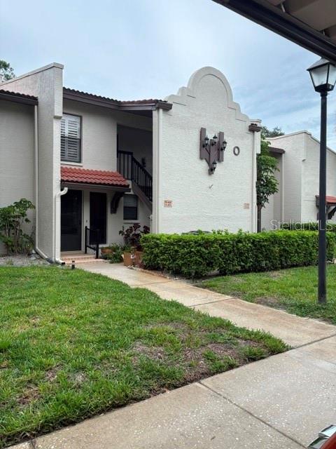 This is move-in ready and sold partially furnished! Beautifully maintained 2-bedroom, 2-bath ground-floor condo is located in the highly desirable East Lake of Palm Harbor, in Tarpon Woods. Offering 1,333 sq. ft. of living space, this light and airy unit features a split-bedroom floor plan and vaulted ceilings, creating an open and spacious feel throughout. Includes peaceful pond views from the spacious living and dining areas, perfect for relaxing or entertaining. The kitchen offers ample cabinet and counter space. A separate interior laundry room includes a full-size washer and dryer for added convenience. The primary bedroom is large with a walk-in closet. The second bedroom is well-sized and ideal for guests or a home office. Enjoy convenient access to Tarpon Woods Golf Club, John Chestnut St Park on Lake Tarpon, the North Pinellas YMCA, shopping, dining, beaches, downtown Palm Harbor, Dunedin, and Tampa International Airport. You are just moments from the heated pool and spa. The unit also includes a dedicated covered carport—conveniently located close to the front door. Major updates include a new roof in 2025 (special assessment already paid) . The monthly HOA fee covers water, sewer, cable, trash, exterior maintenance, roof, and building insurance—offering true maintenance-free living. Ideally located near walking and biking trails, John Chestnut Park, Lake Tarpon, East Lake YMCA, golf courses, shopping, dining, and just a short drive to area beaches and Tampa International Airport. This home is perfect as a primary residence, vacation home, or seasonal retreat in one of Palm Harbor’s most highly sought-after areas!