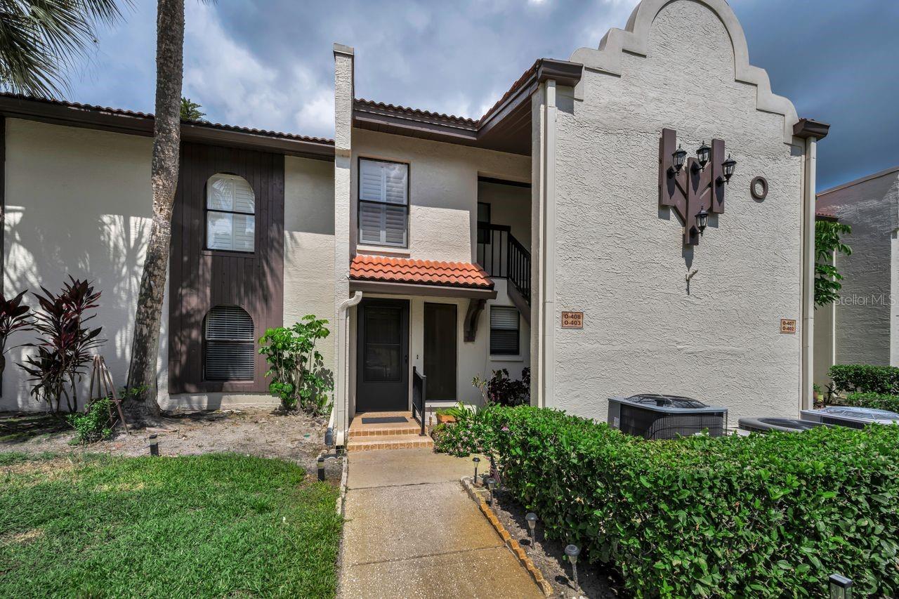 This is move-in ready and sold partially furnished! Beautifully maintained GROUND FLOOR , 2-bedroom, 2-bath condo is located in the highly desirable East Lake of Palm Harbor, in Tarpon Woods. Offering 1,333 sq. ft. of living space, this light and airy unit features a split-bedroom floor plan and vaulted ceilings, creating an open and spacious feel throughout. Includes peaceful pond views from the spacious living and dining areas, perfect for relaxing or entertaining. The kitchen offers ample cabinet and counter space. A separate interior laundry room includes a full-size washer and dryer for added convenience. The primary bedroom is large with a walk-in closet. The second bedroom is well-sized and ideal for guests or a home office. Enjoy convenient access to Tarpon Woods Golf Club, John Chestnut St Park on Lake Tarpon, the North Pinellas YMCA, shopping, dining, beaches, downtown Palm Harbor, Dunedin, and Tampa International Airport. You are just moments from the heated pool and spa. The unit also includes a dedicated covered carport—conveniently located close to the front door. Major updates include a new roof in 2025 (special assessment already paid) . The monthly HOA fee covers water, sewer, cable, trash, exterior maintenance, roof, and building insurance—offering true maintenance-free living. Ideally located near walking and biking trails, John Chestnut Park, Lake Tarpon, East Lake YMCA, golf courses, shopping, dining, and just a short drive to area beaches and Tampa International Airport. This home is perfect as a primary residence, vacation home, or seasonal retreat in one of Palm Harbor’s most highly sought-after areas!