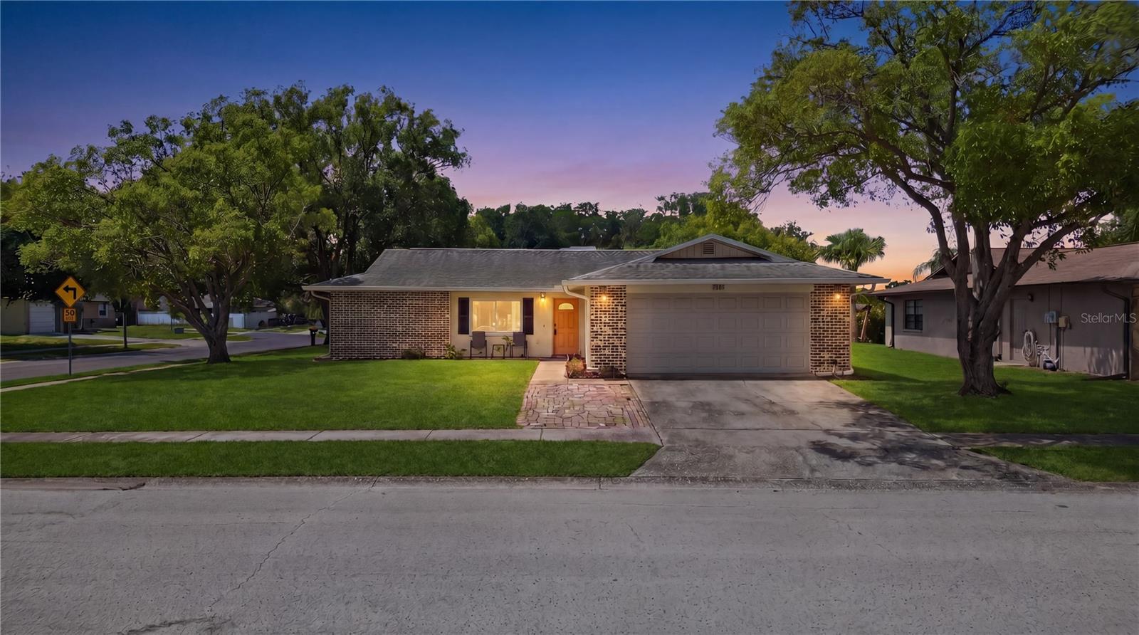 Welcome to this beautifully maintained home situated on a spacious corner lot located in New Port Richey, FL, just minutes from Trinity and close to shopping, restaurants, schools, parks, and everyday conveniences. This move-in ready property offers peace of mind with numerous updates throughout, including a new roof (2017), new A/C system (2017), updated garage door (2014), and the majority of the home featuring energy-efficient double-pane windows.

Inside, you'll find a functional layout with an indoor laundry room and a well-cared-for interior that reflects true pride of ownership. The kitchen features updated appliances including a range and dishwasher (2021), refrigerator (2025), and washer and dryer (2017). The primary bathroom has been refreshed with a new vanity in 2025, while a water softener adds additional comfort and convenience.

Step outside to enjoy the fully fenced backyard enclosed with durable PVC vinyl fencing, providing privacy and plenty of space for pets, play, or outdoor entertaining. The oversized two-car garage offers ample storage and parking.

An added bonus is the affordable flood insurance, with the current owners paying only approximately $600 annually. Combining thoughtful updates, excellent maintenance, a desirable corner lot, and a location near Trinity, this home is a fantastic opportunity for buyers seeking value, comfort, and convenience. Schedule your tour today!