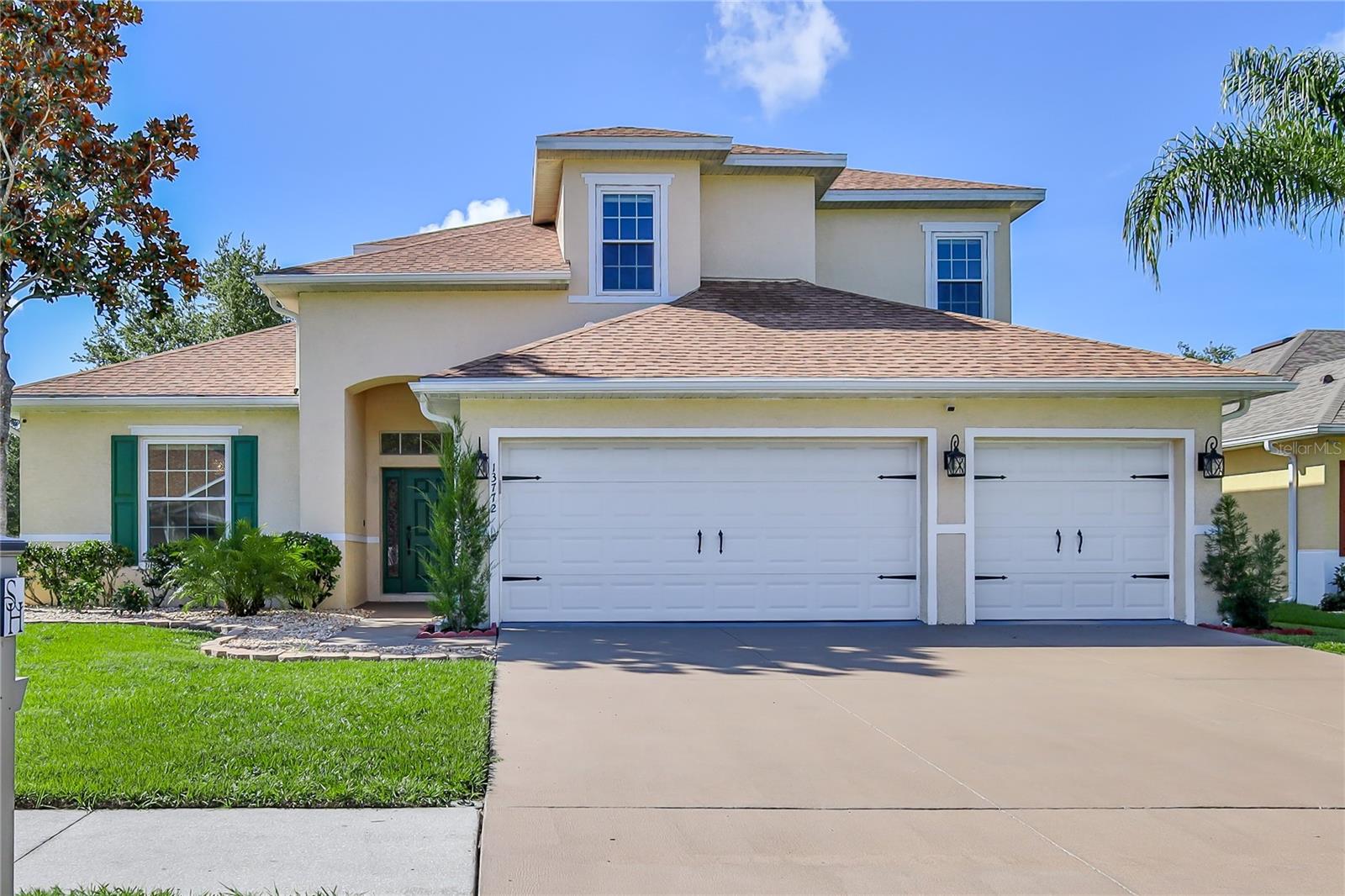 MOVE In Ready! Immaculate 4-Bedroom 3-Car Garage Home on Corner Lot in Gated Community! This beautifully updated home offers the perfect blend of modern luxury and functional design. Major upgrades completed in 2022 include: new roof, double pane windows, HVAC systems (2), garage doors, 50-gallon water heater, and Pergo laminate flooring throughout. Freshly painted inside and out, with designer lighting and chandeliers adding a touch of elegance. The chef's kitchen features granite countertops, soft-close wood cabinetry, new stainless appliances, a center island, closet pantry, and breakfast bar. The formal dining room sits just off the kitchen, while the spacious living room boasts soaring 21' ceilings, a breakfast nook, and access to a powder bath with granite counters, soft-close vanity and vessel sink. The main-level owner's suite offers private lanai access, a large walk-in closet, and a spa-like bath with dual vessel sinks, granite counters, a garden tub, and separate shower. Upstairs are three generously sized bedrooms, each with double-door closets and new ceiling fans, plus a fully updated bathroom with dual vessel sinks and granite counters. Additional highlights: inside laundry with washer, dryer, utility sink, and wine storage, water softener, smart irrigation with 6 zones, new electrical outlets inside/out, motion sensor lights, security cameras, and vinyl privacy-fenced backyard. Located in a resort-style gated community with two clubhouses, two pools, fitness center, tennis courts, playground, splash pad, and boat/RV parking. This is your opportunity to own one of the most updated homes in the community without the wait or expense of renovations. Don't miss this move-in ready gem!